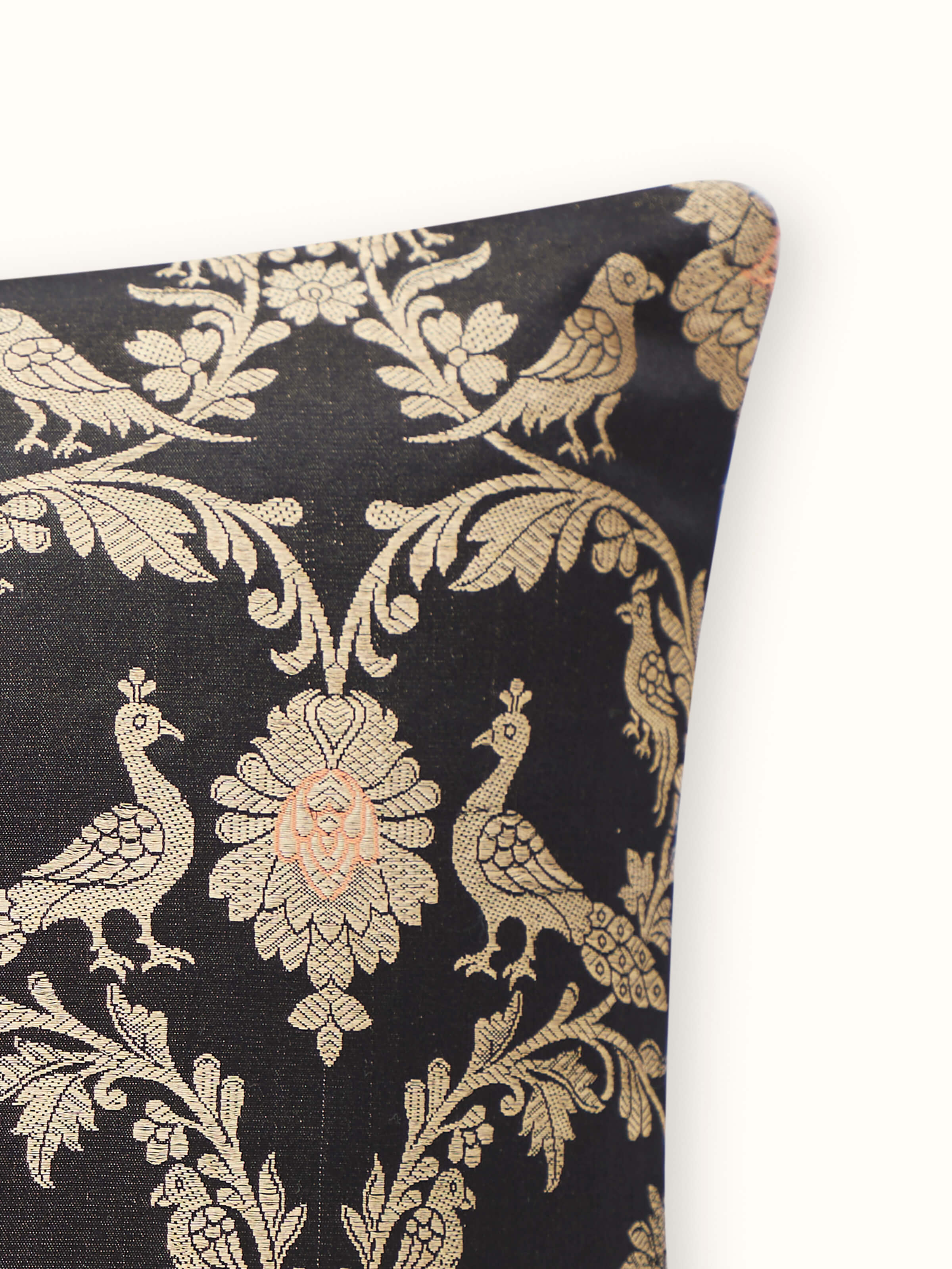 Detail shot of cushion edges and sheen of handloom silk weaving.