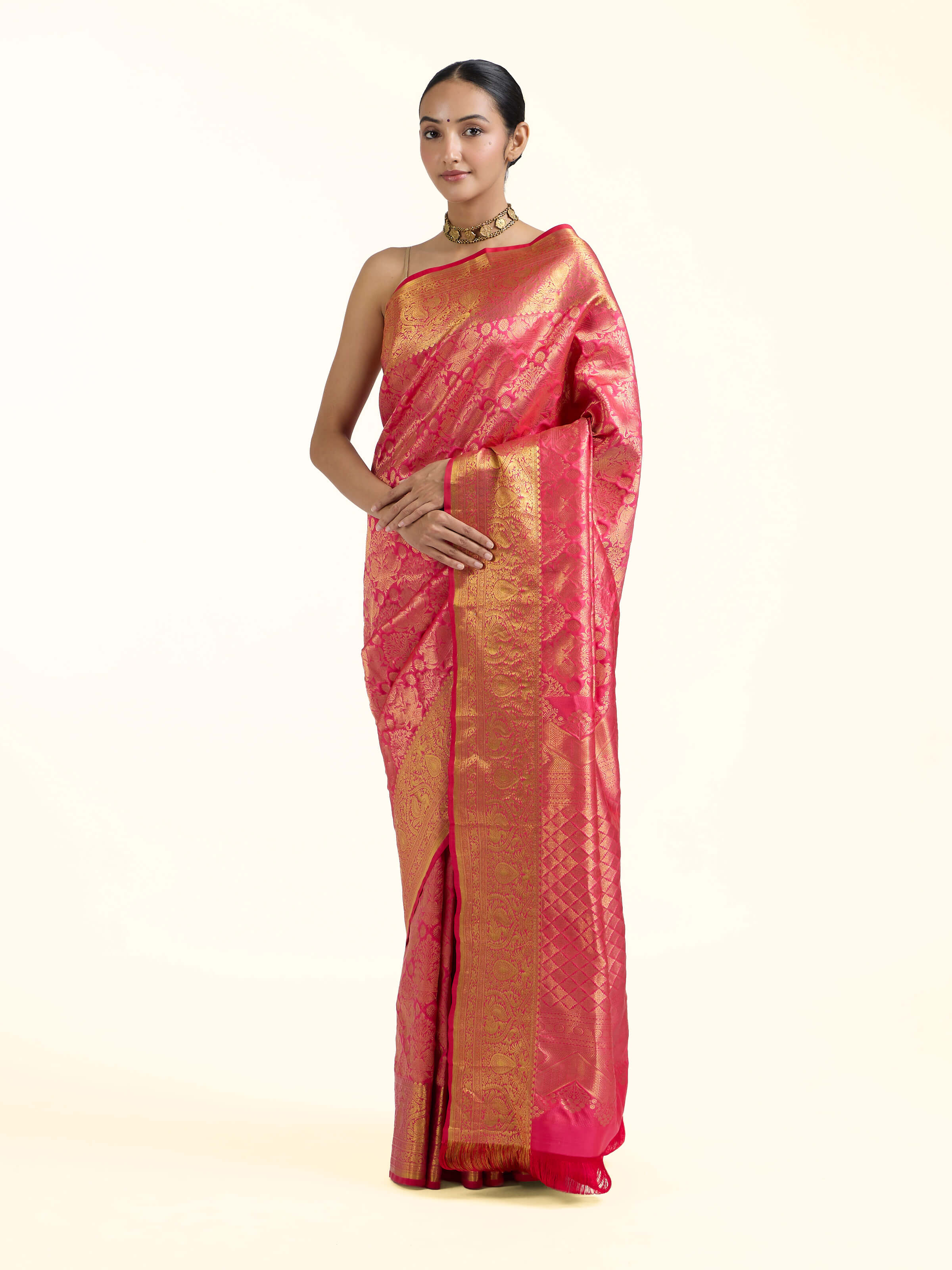 Side view of red silk Kancheepuram saree showcasing flowing drape