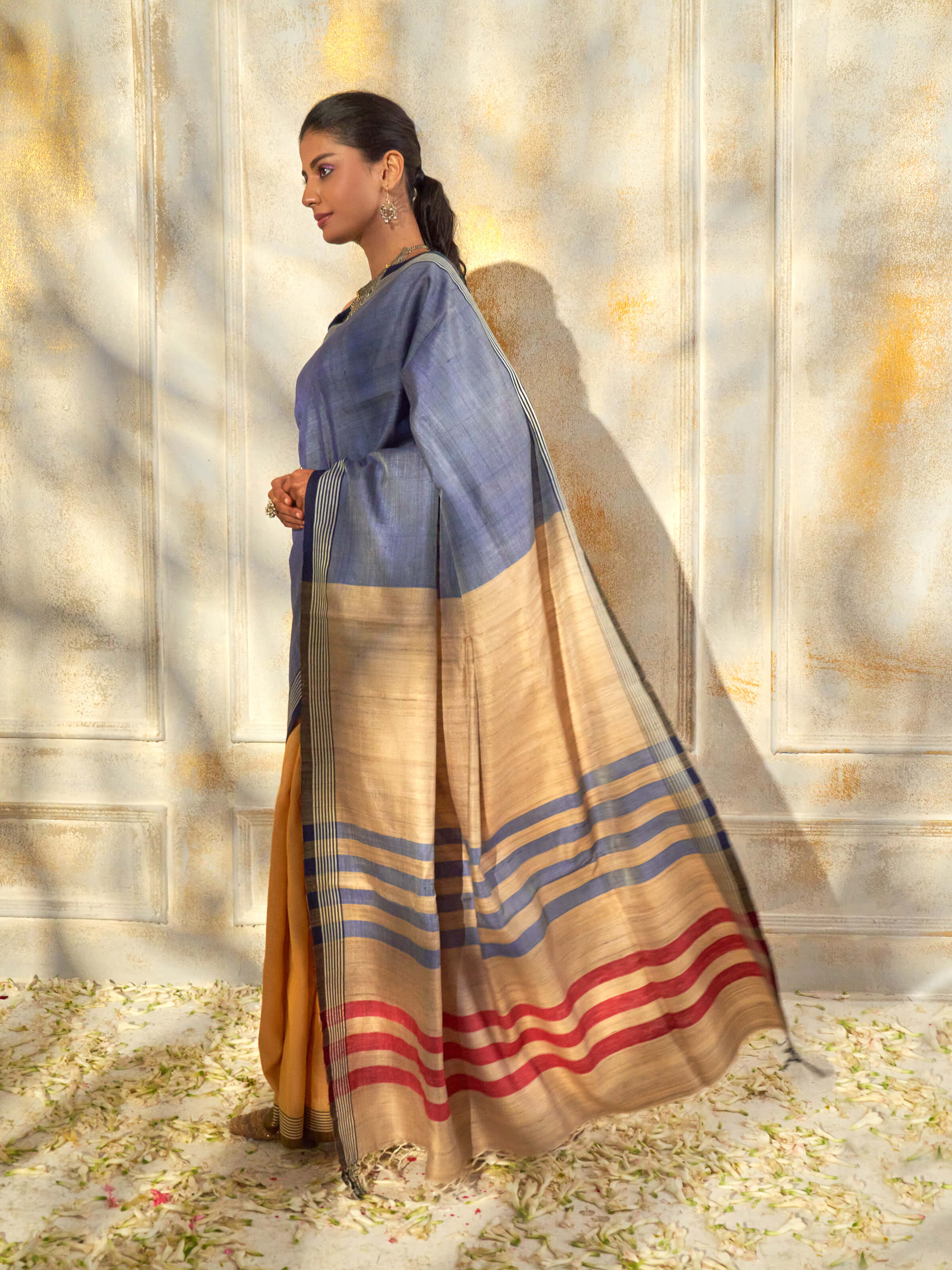 Angled view of blue tussar silk Bhagalpur saree showing full length design