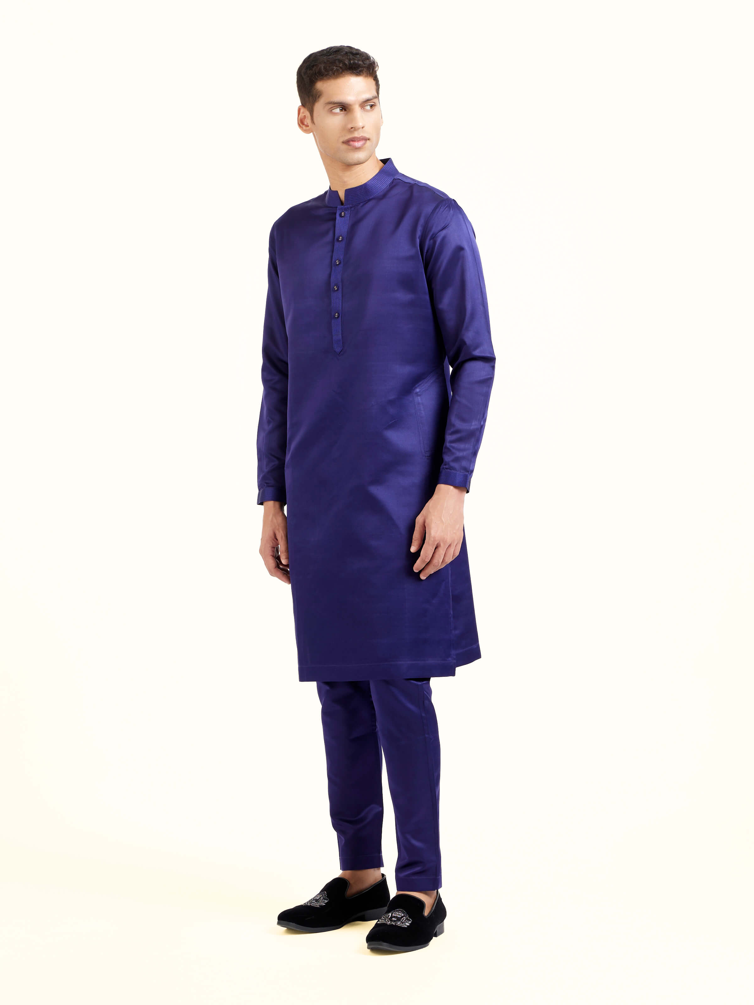 Side view of navy blue katan silk Banarasi midi kurta pant set with elegant silhouette