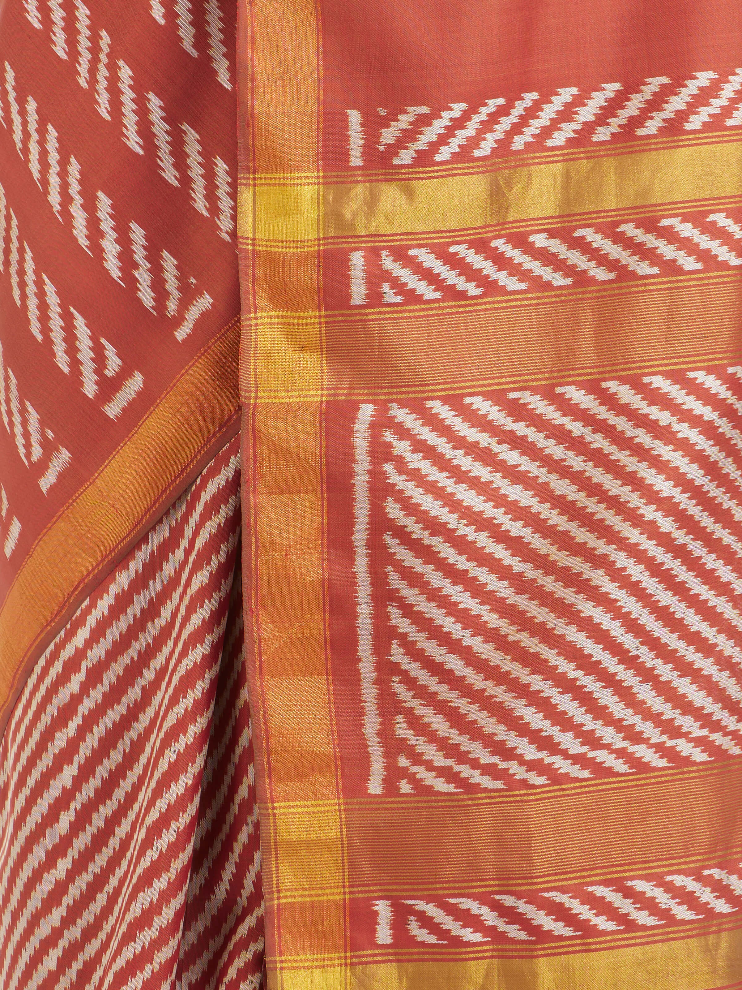 Detail view of pink mulberry silk Patola saree showing silk texture