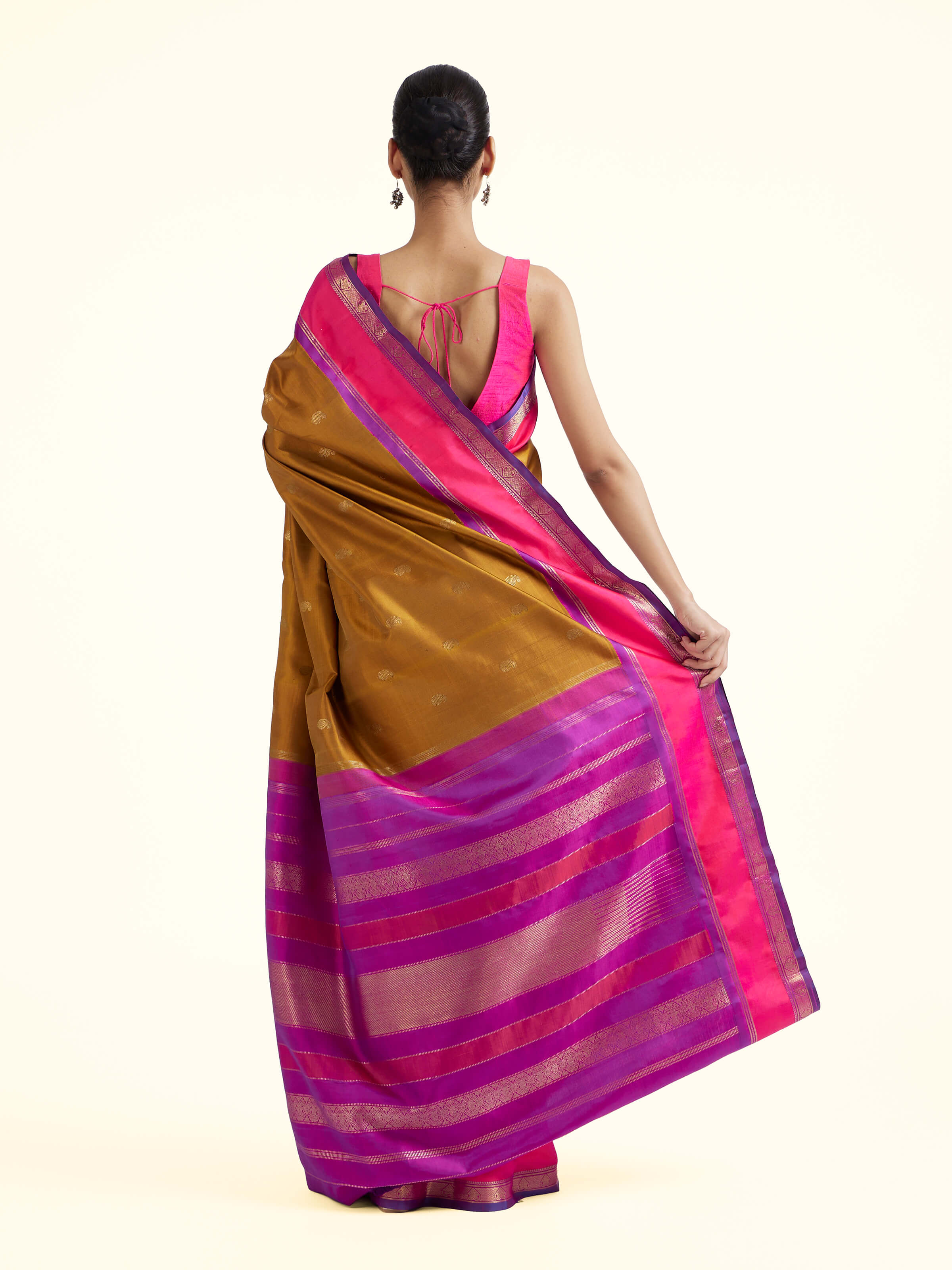 Back view of olive silk Kancheepuram saree displaying ornate pallu design