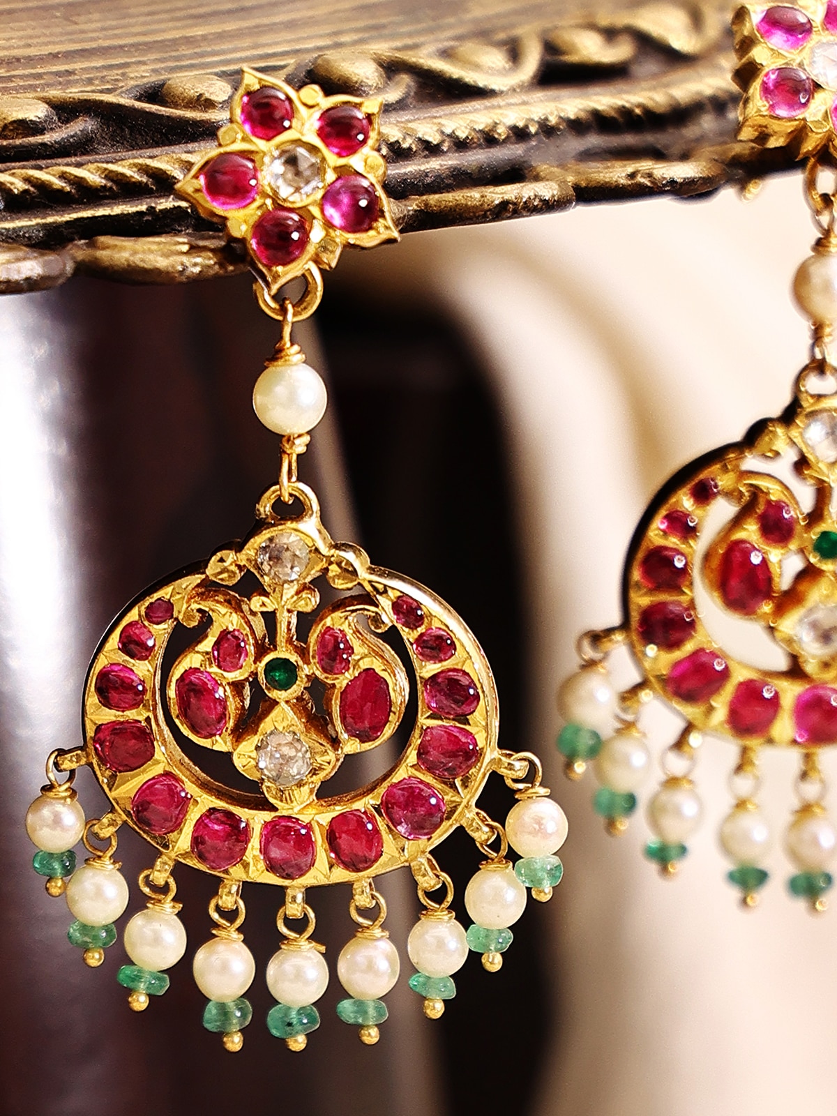 Detailed front view of Kundala Velai 22 karat gold drop earrings highlighting their exquisite design