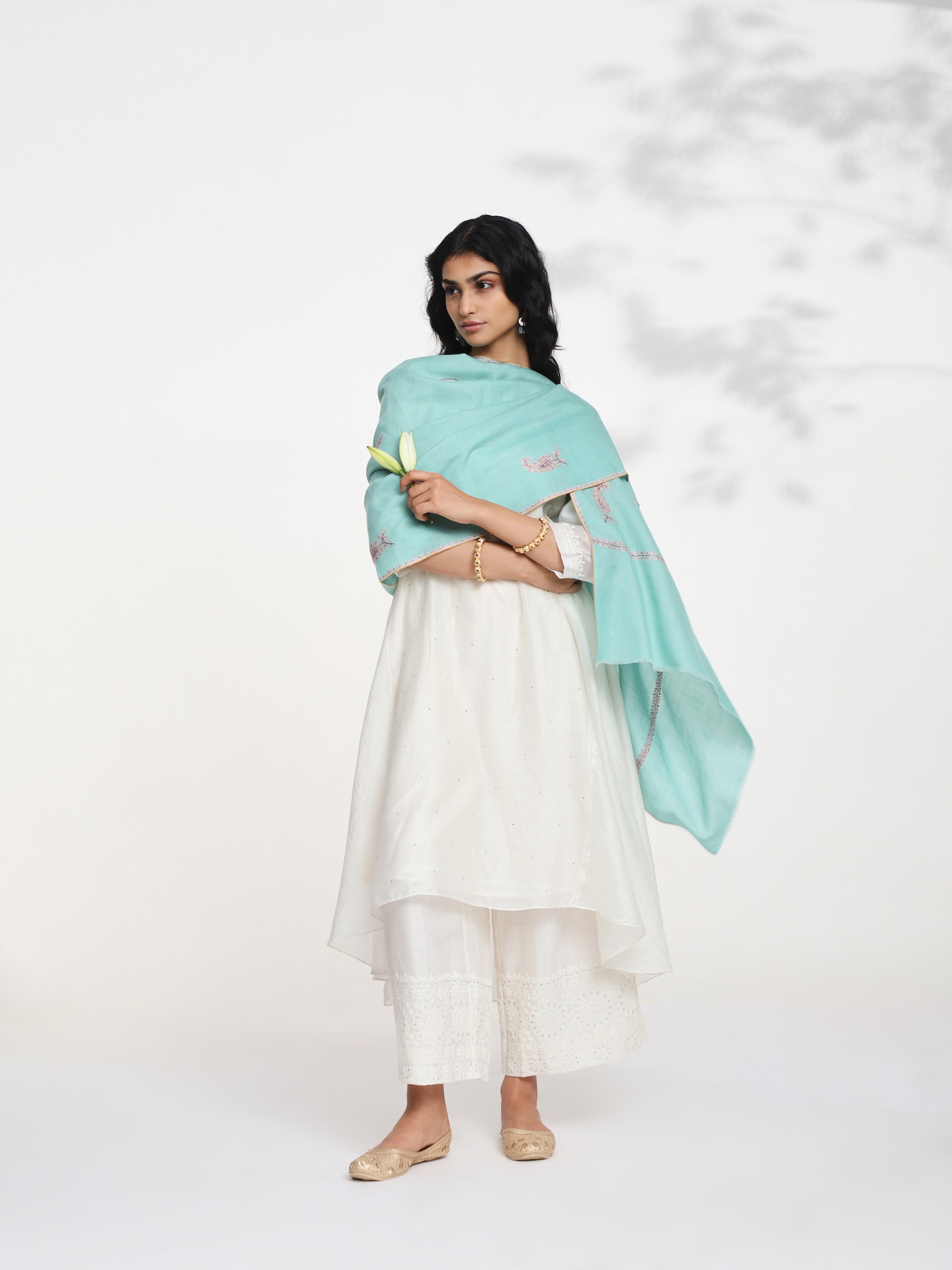 Side view of rust jalidar sozni embroidered stole highlighting soft drape