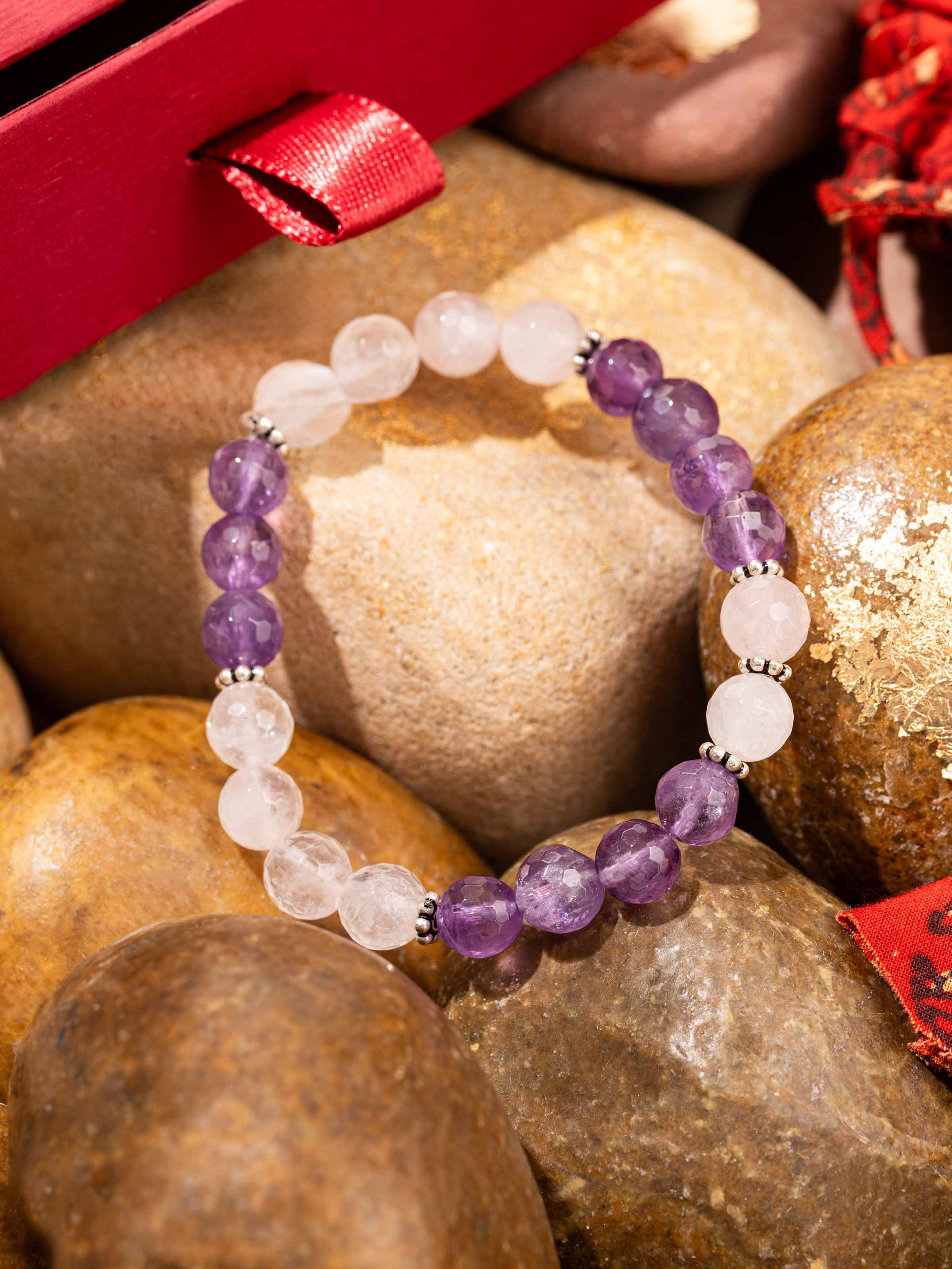 Detailed image of Amethyst & Rose Quartz Silver Bracelet displaying the smooth stone finish and silver detailing