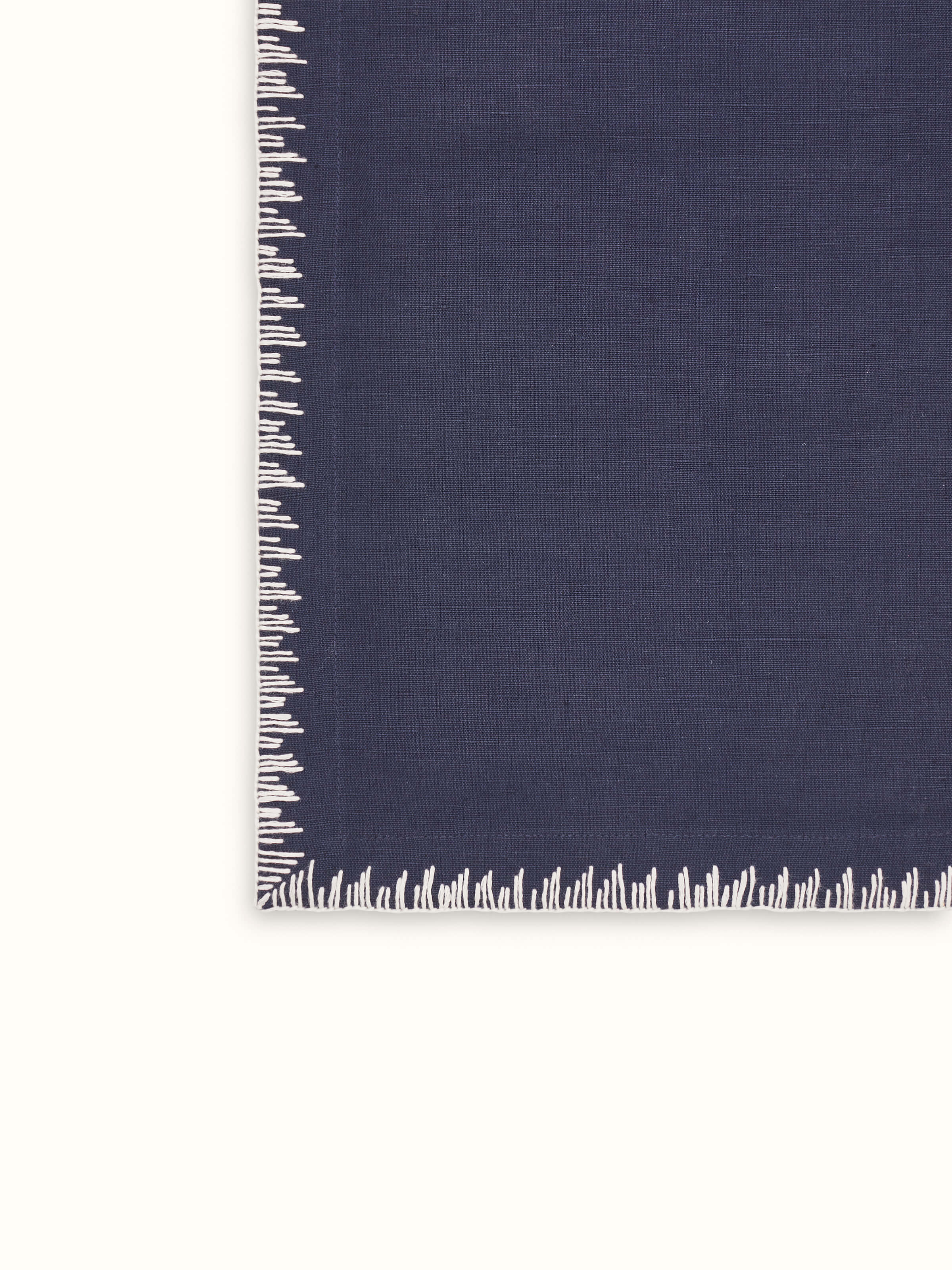 Texture and fabric detail of linen cotton indigo embroidered table mat