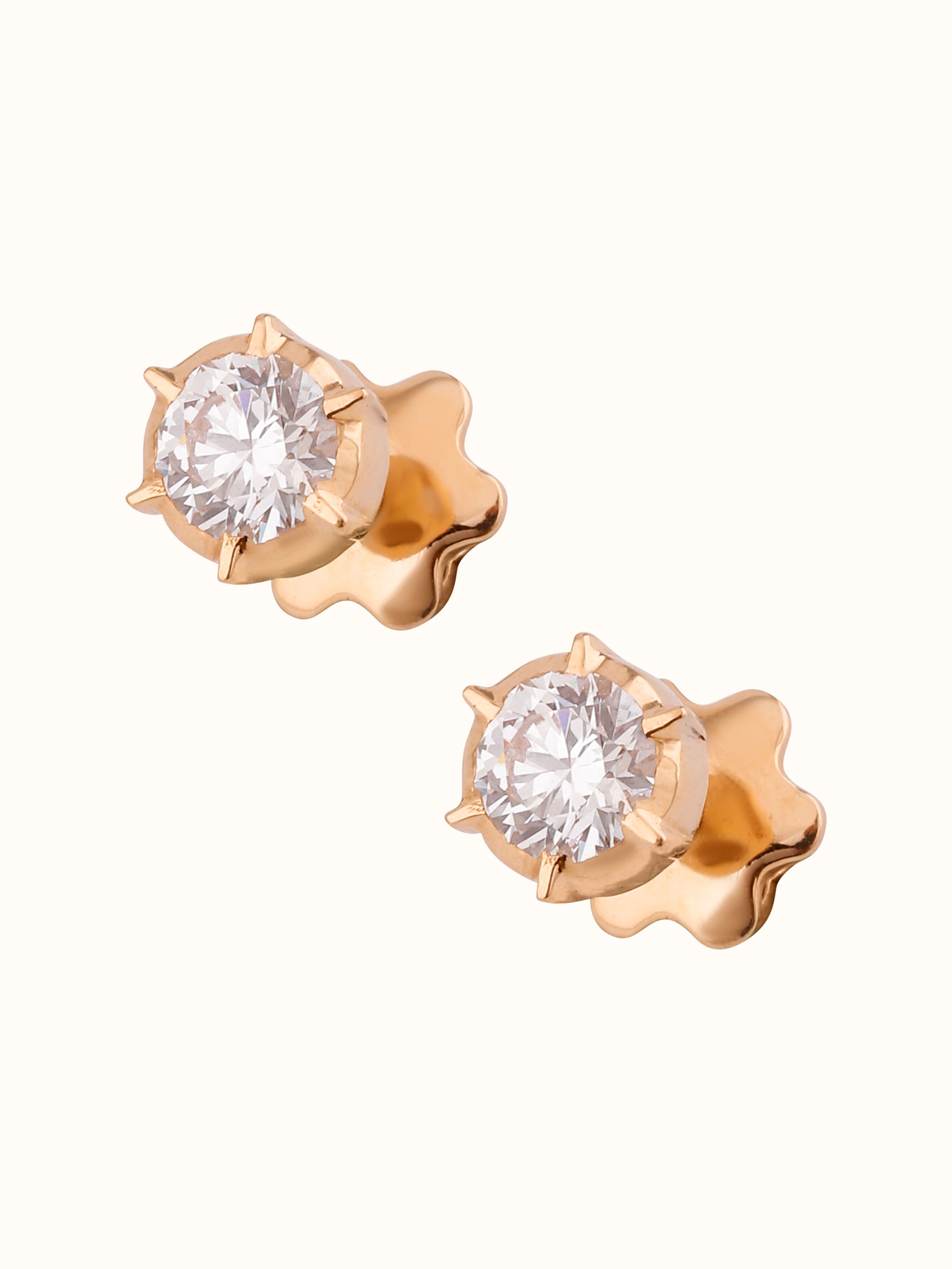 Overhead view of Close-setting 22 Karat Gold Studs capturing the symmetrical circular pattern.