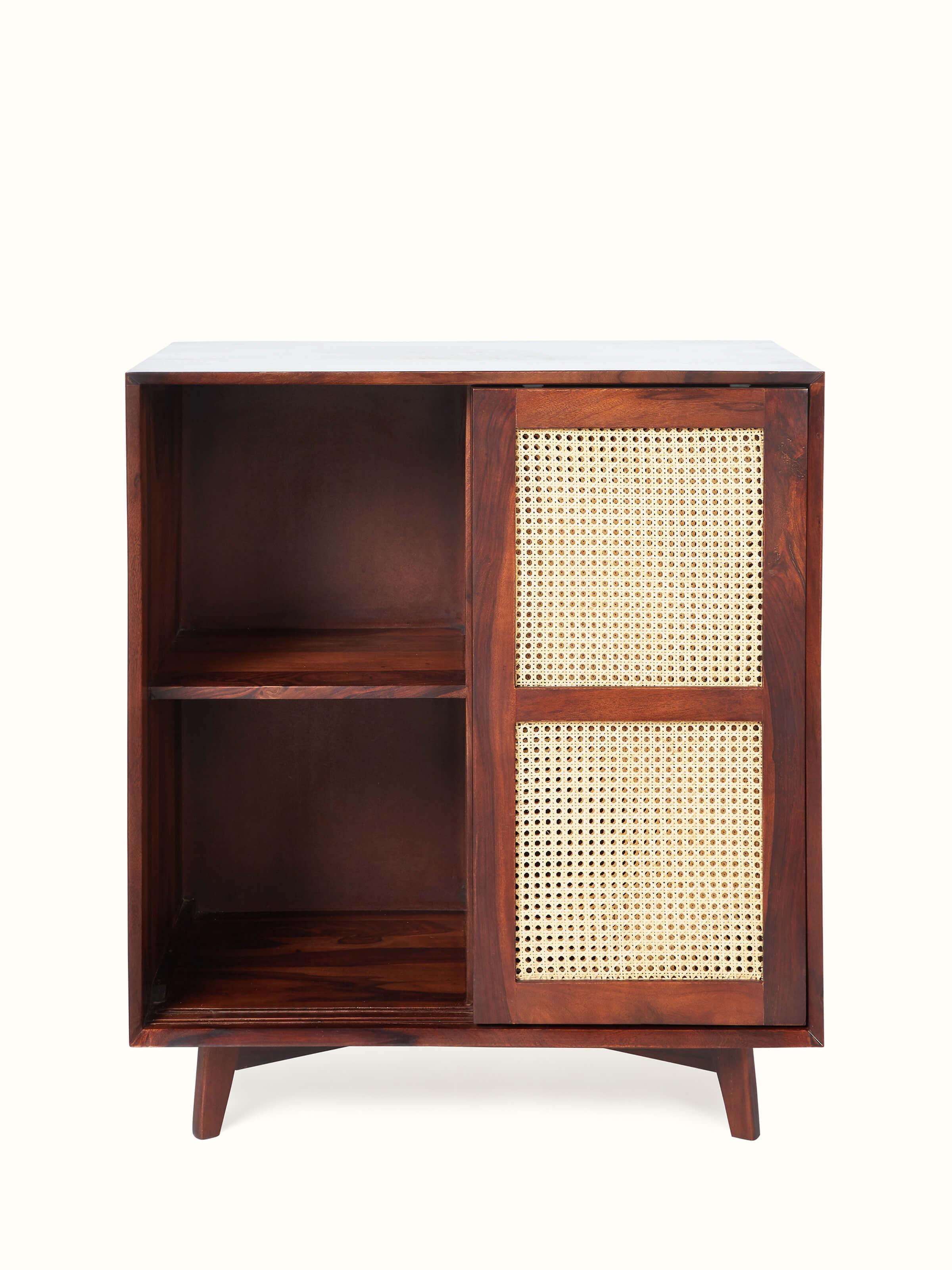 Detailed view of the Sheesham wood and cane bar cabinet, emphasizing the texture of the cane and the wood’s finish.