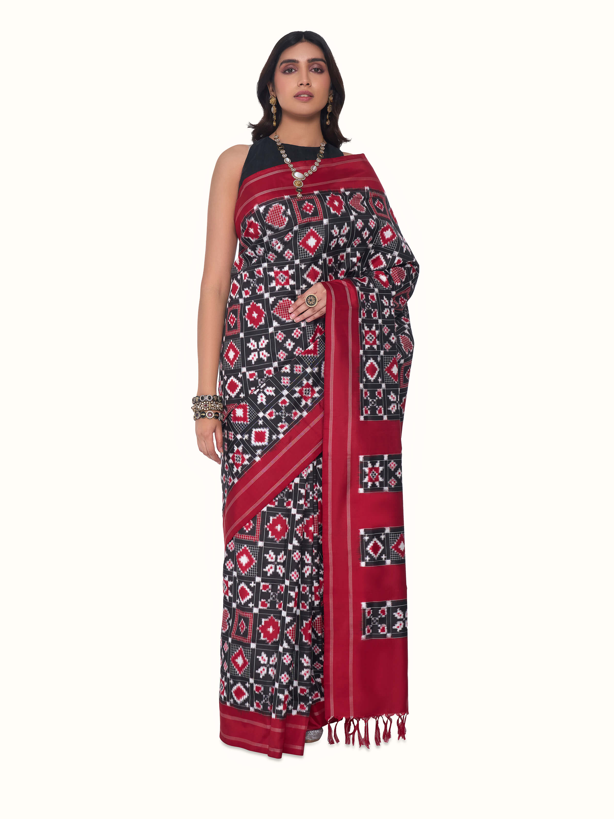 Front view of red silk Telia Rumal double ikat saree with traditional geometric motifs