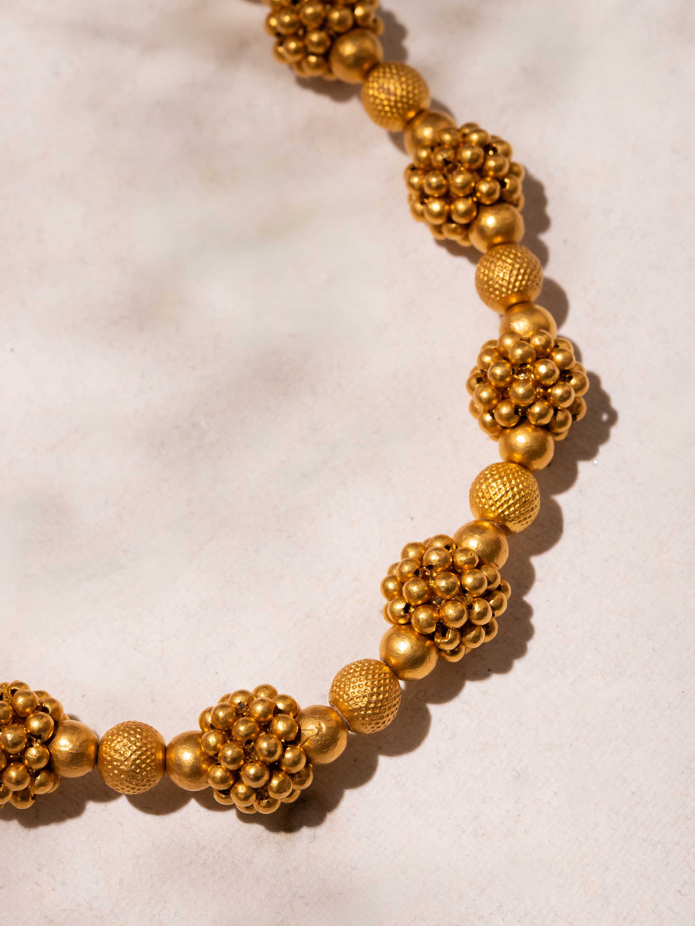 Close-up of craftsmanship on Thushi 22 karat collar necklace