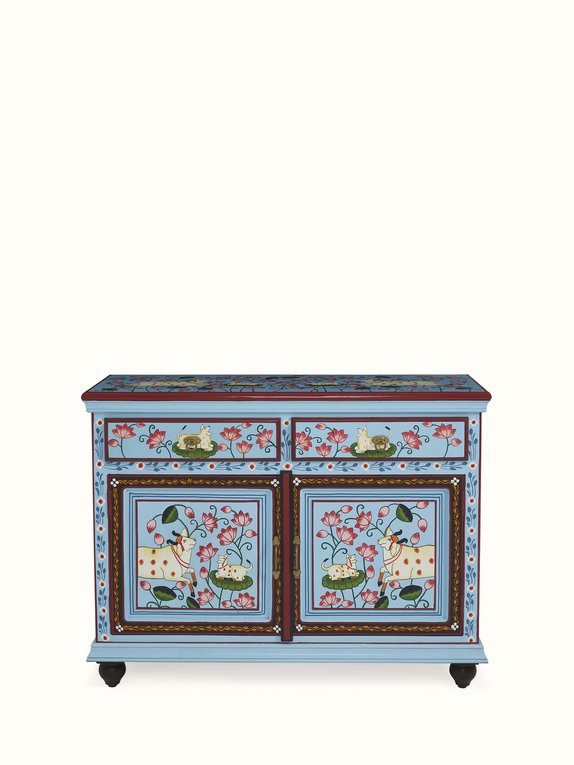 Front view of carved wooden chest of drawers with Indian motifs – handcrafted Swadesh design