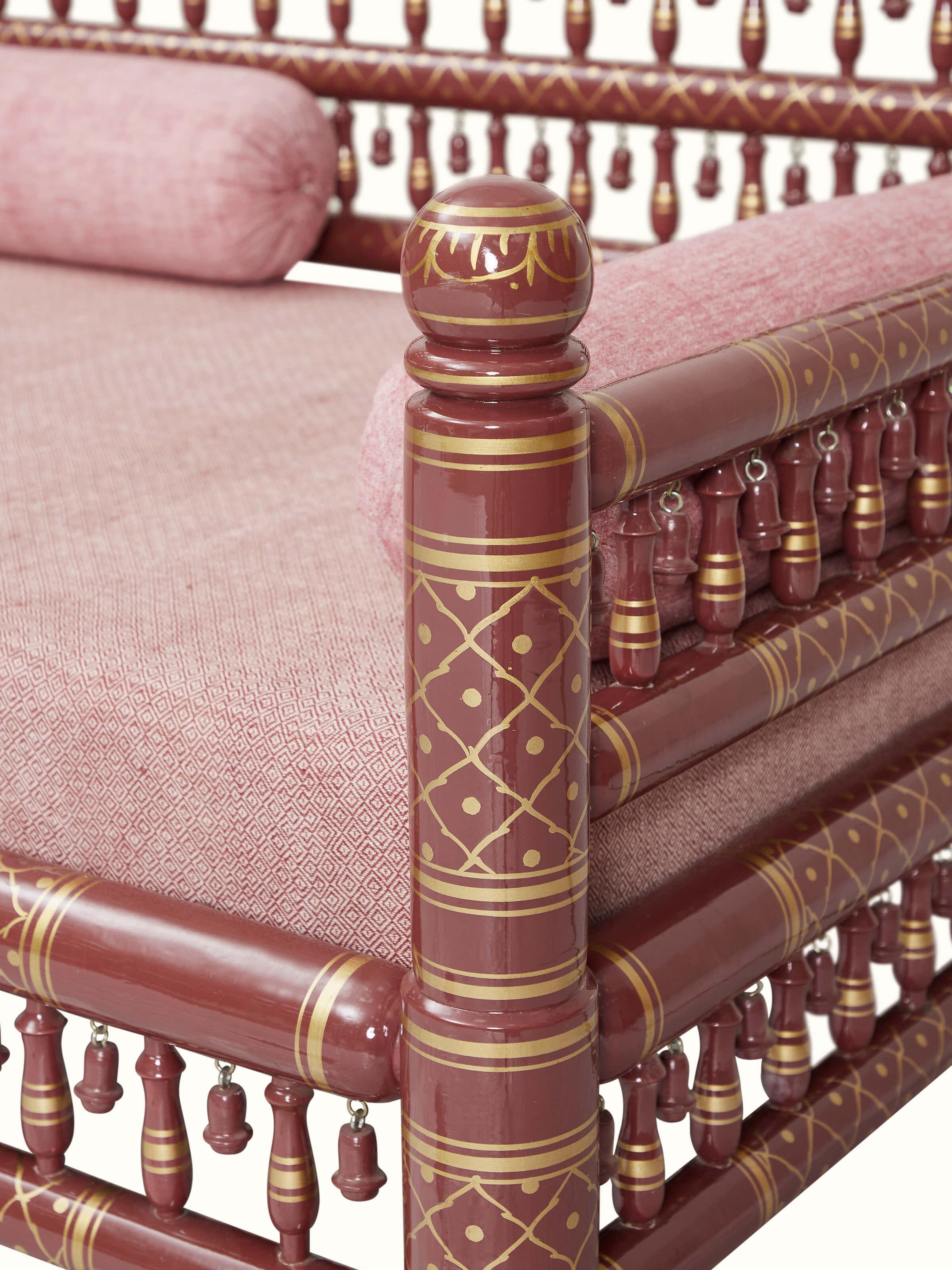 Close-up of the upholstery and woodwork on the Sankheda 2-seater sofa, showcasing the intricate details and craftsmanship