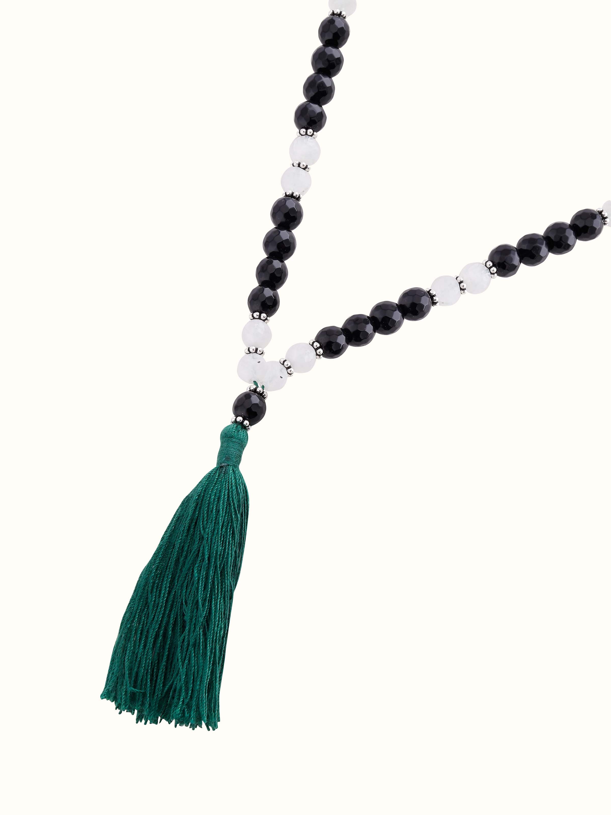Overhead view of mala necklace capturing color harmony and refined spiritual design