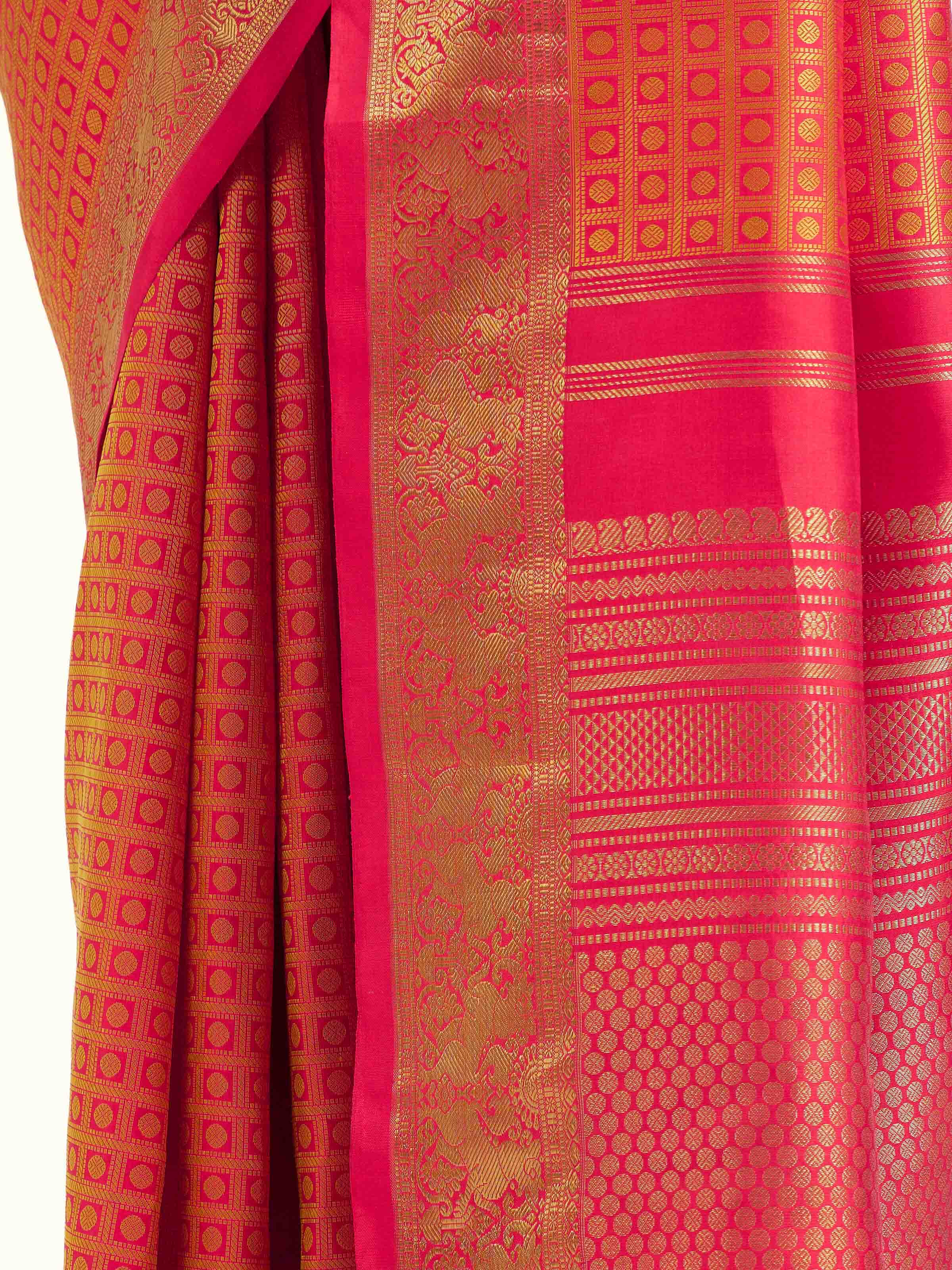 Detail view of gold silk Kancheepuram saree showing luxurious silk texture and zari craftsmanship