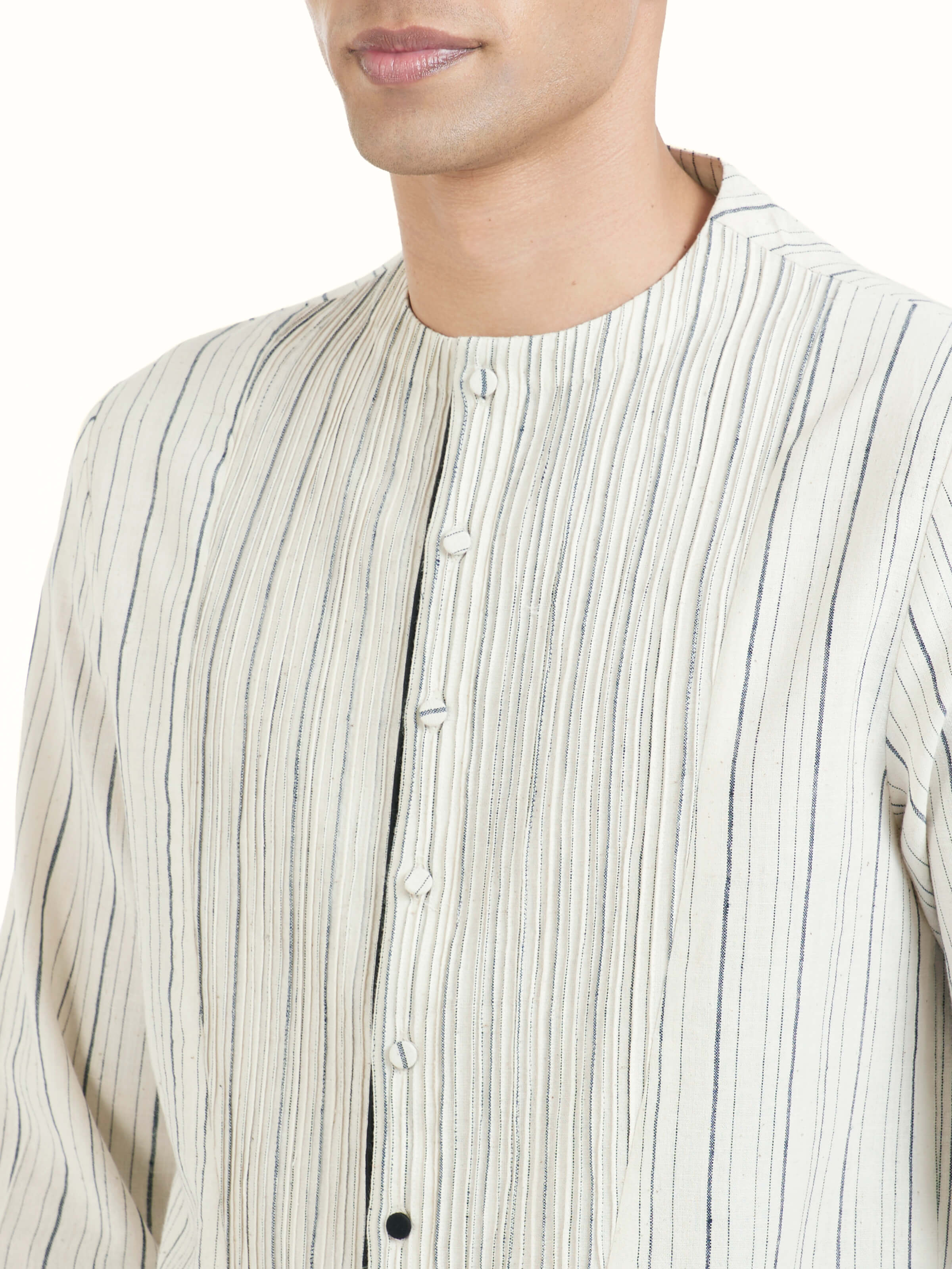 Detail view of ivory silk handloom kurta showing handloom weave texture