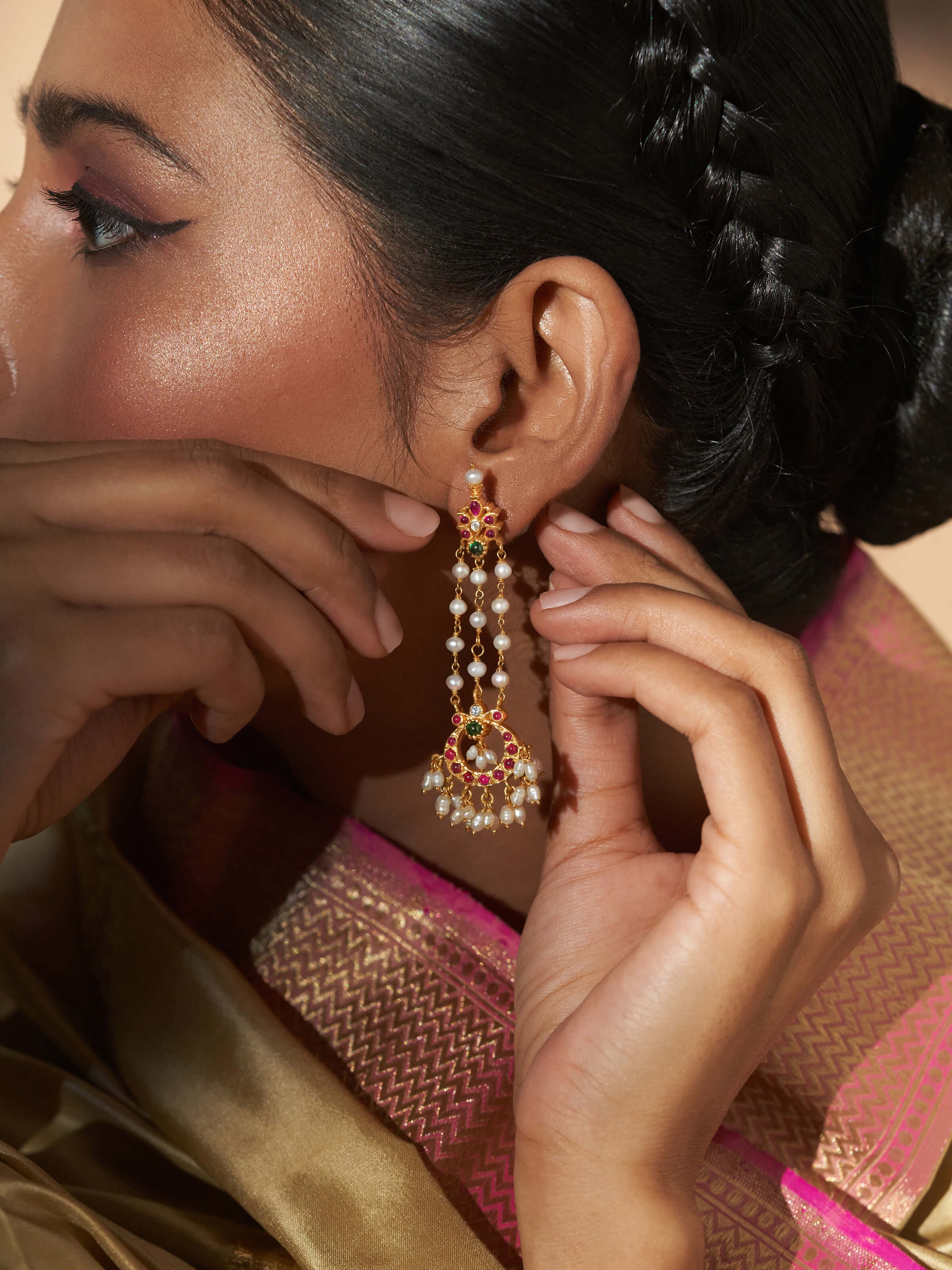 Side view capturing the earrings’ elegant drop shape and handcrafted silver details
