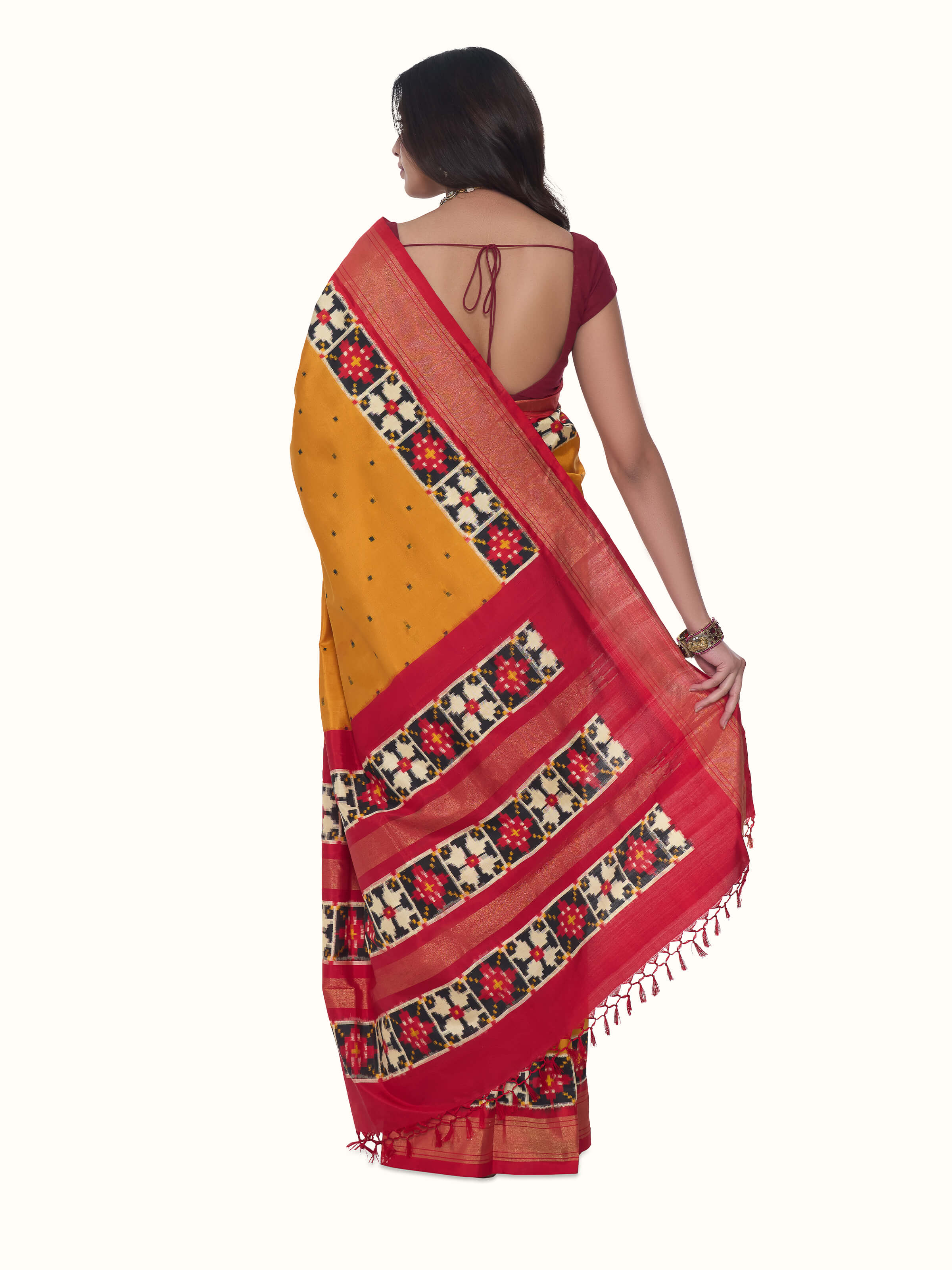 Back view of yellow silk Pochampally double ikat saree displaying overall design