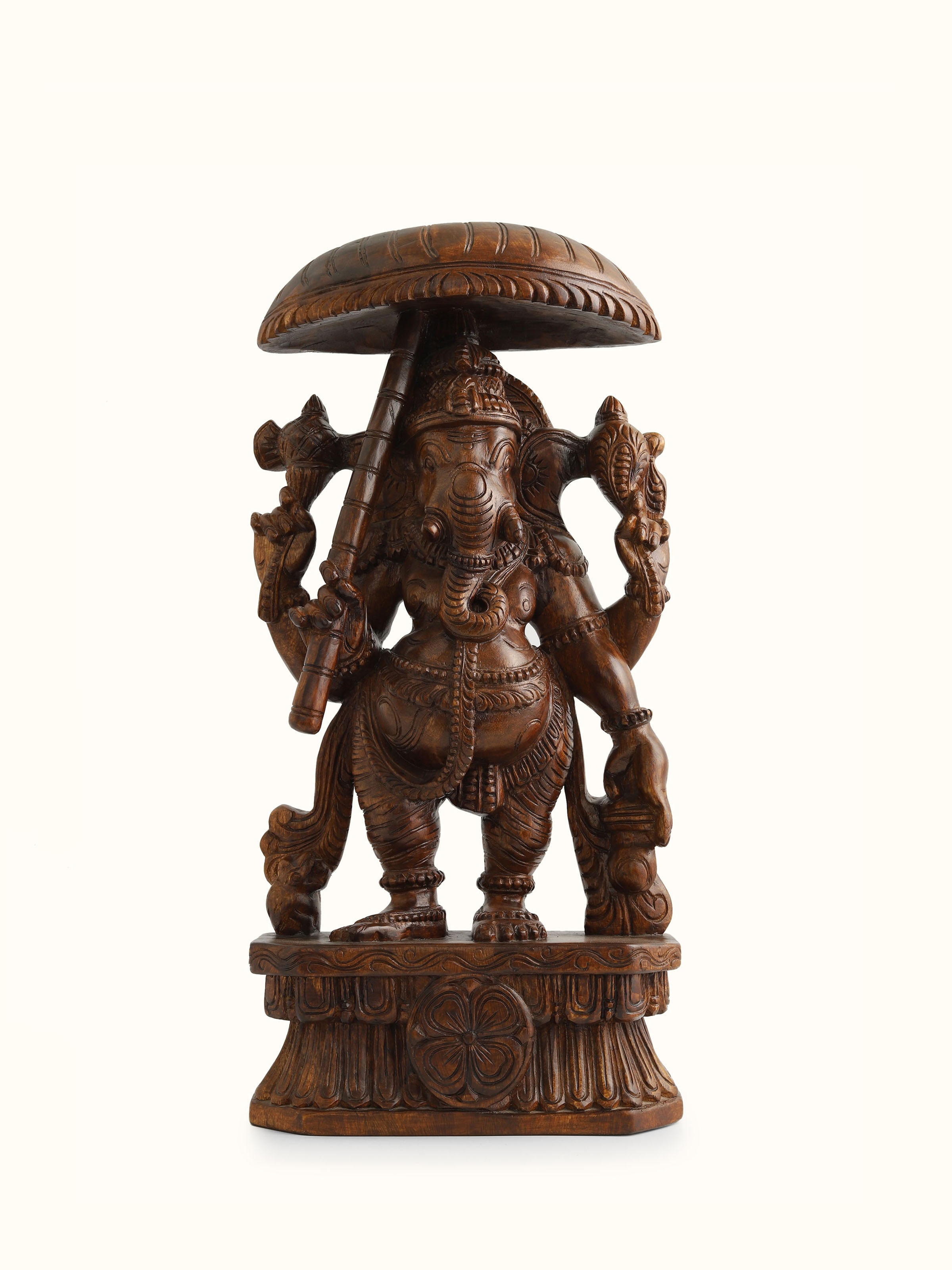 Front view of Siddhipriya Mara Silai Vaagai Wood Ganesha Idol with Umbrella, showcasing the finely detailed carving and traditional posture.