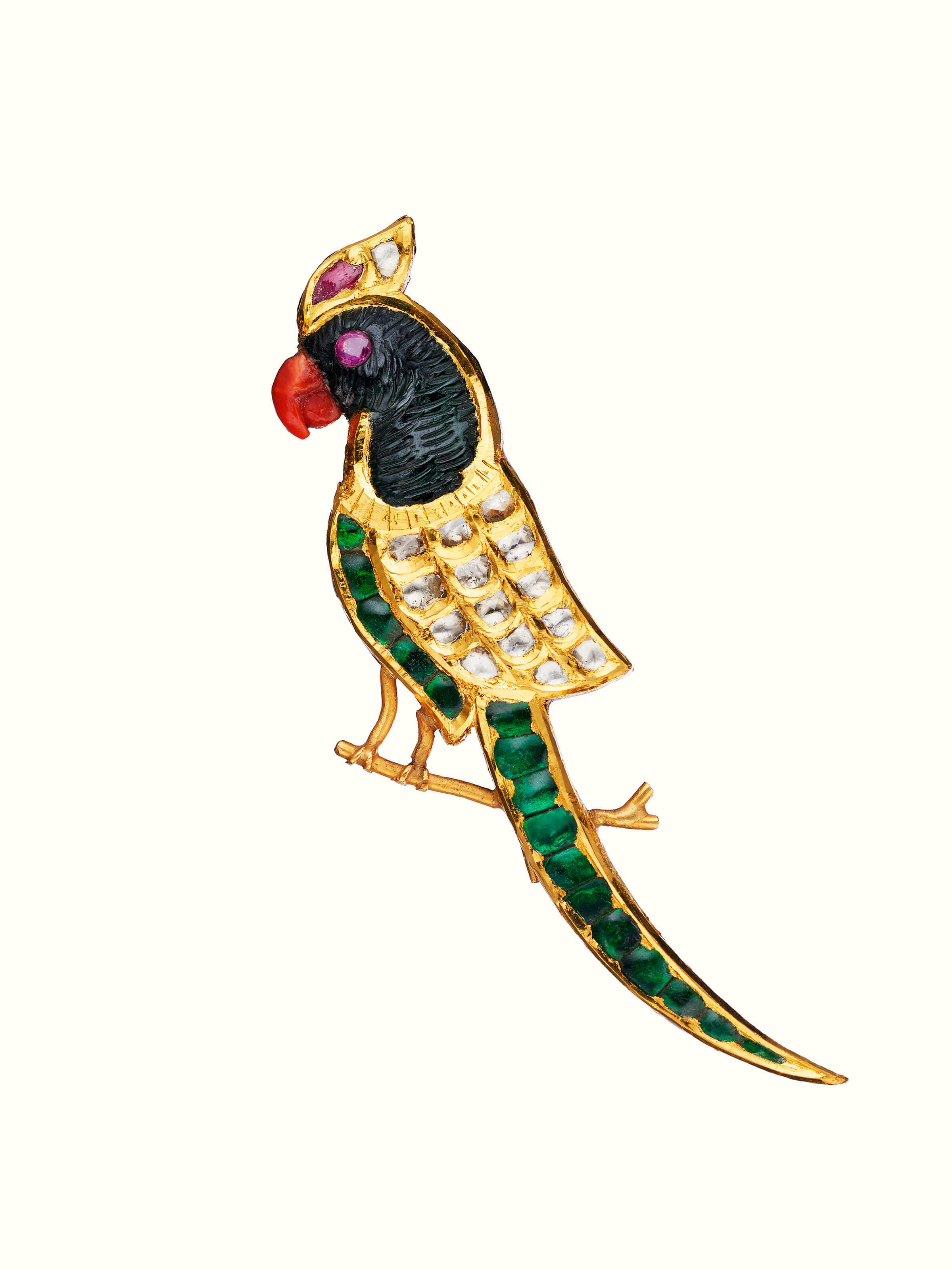 front view of jadau gold brooch pin with traditional stone setting