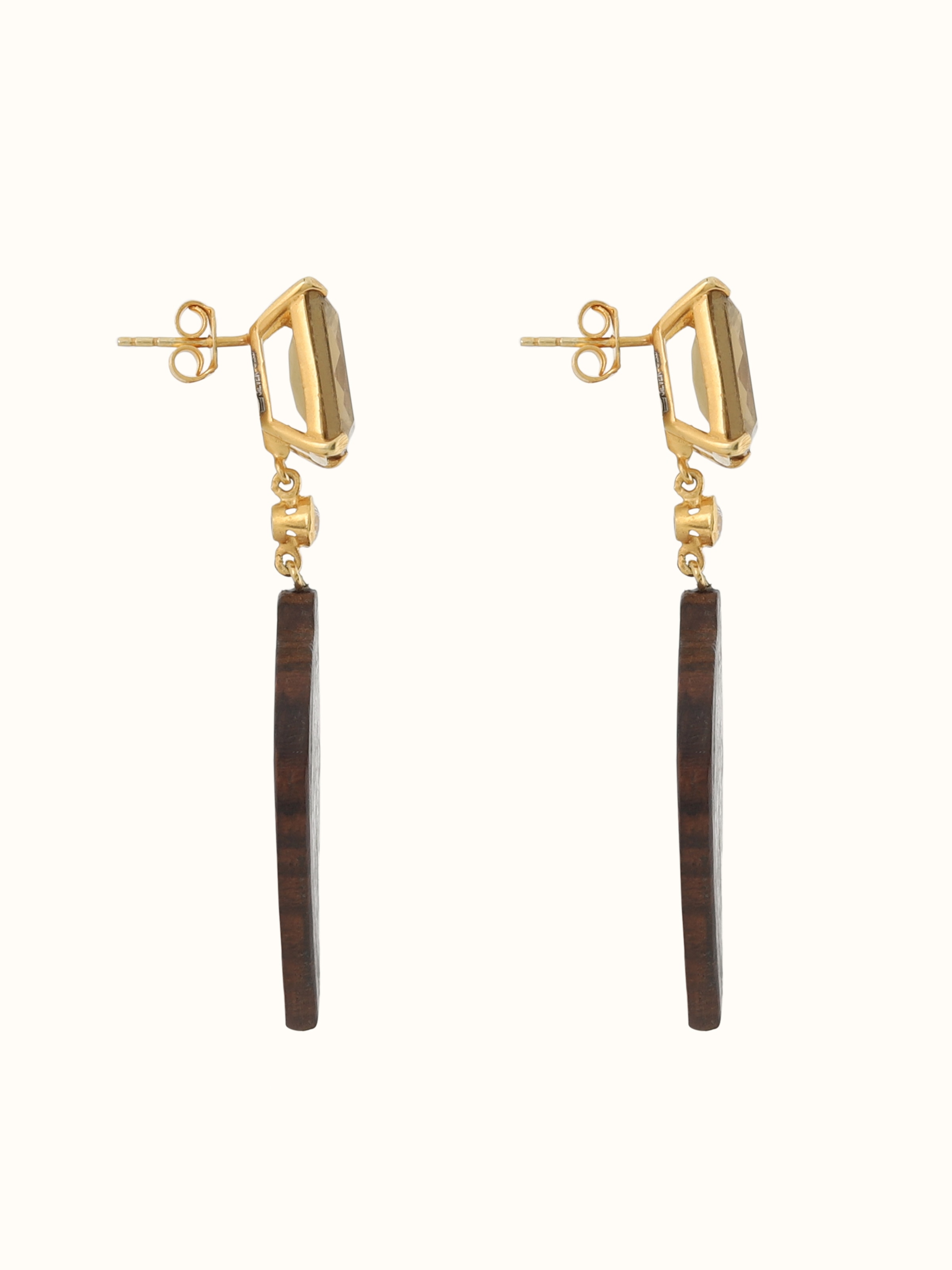 Side view of drop earrings highlighting depth and curve of the silver design