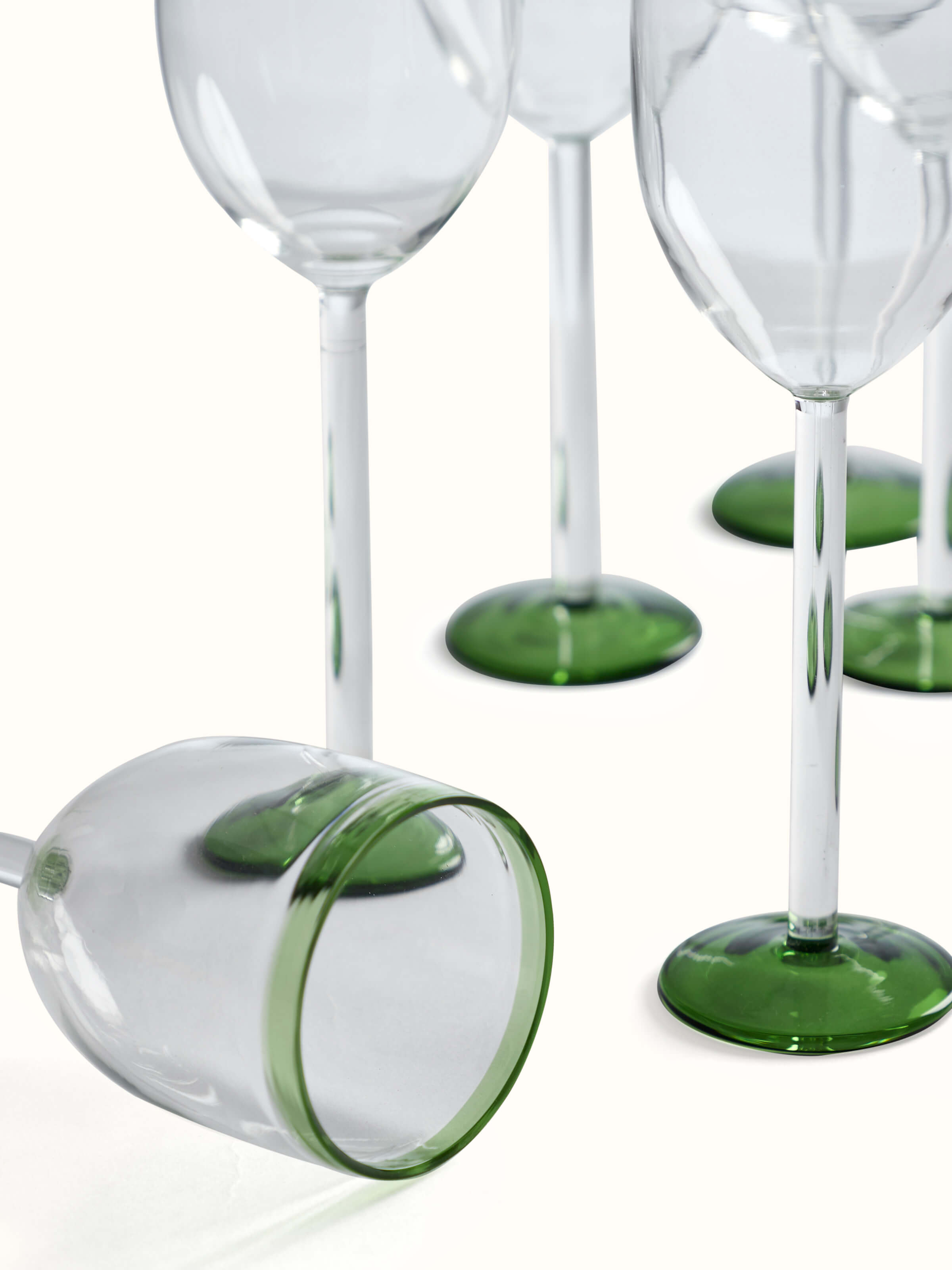 Close-up of the rim of green wine glasses (6 pcs), focusing on the smooth edge and green tint.