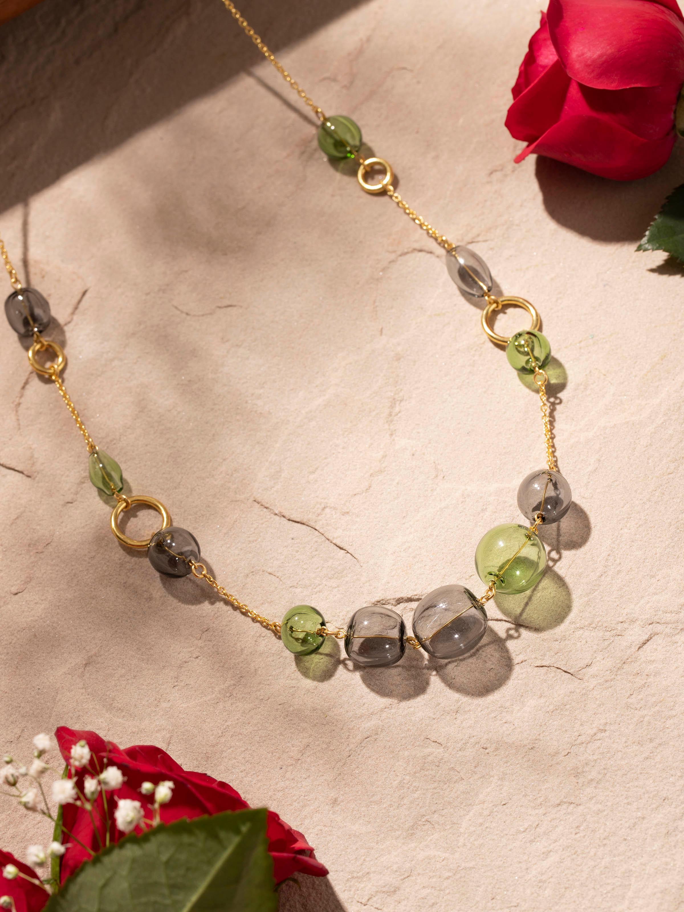 Side view of Glass Flamework Silver Long Necklace showcasing the elegant design and colorful glass elements.