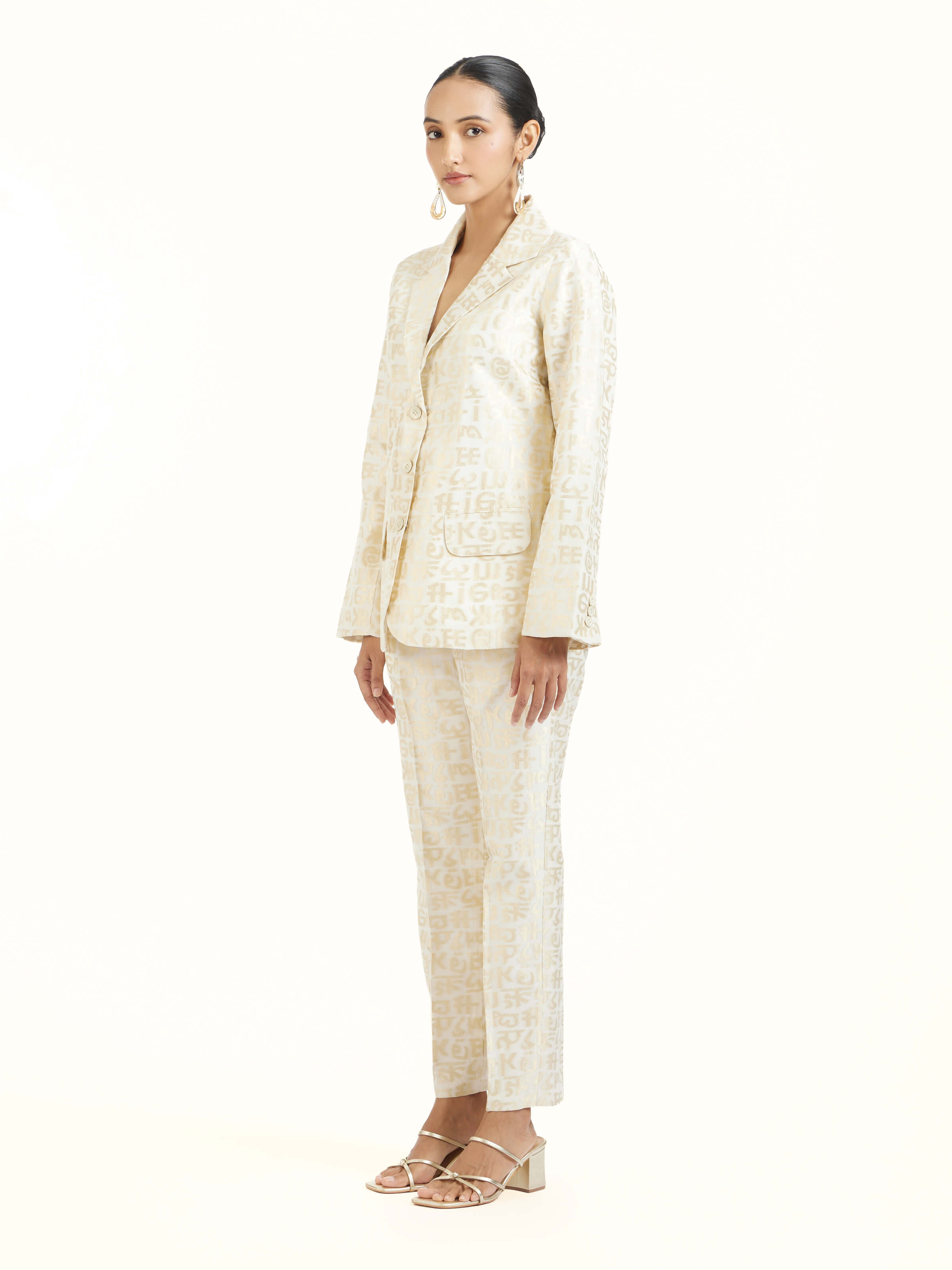 Side view of ivory handloom cut work calligraphy co-ord set highlighting structured silhouette