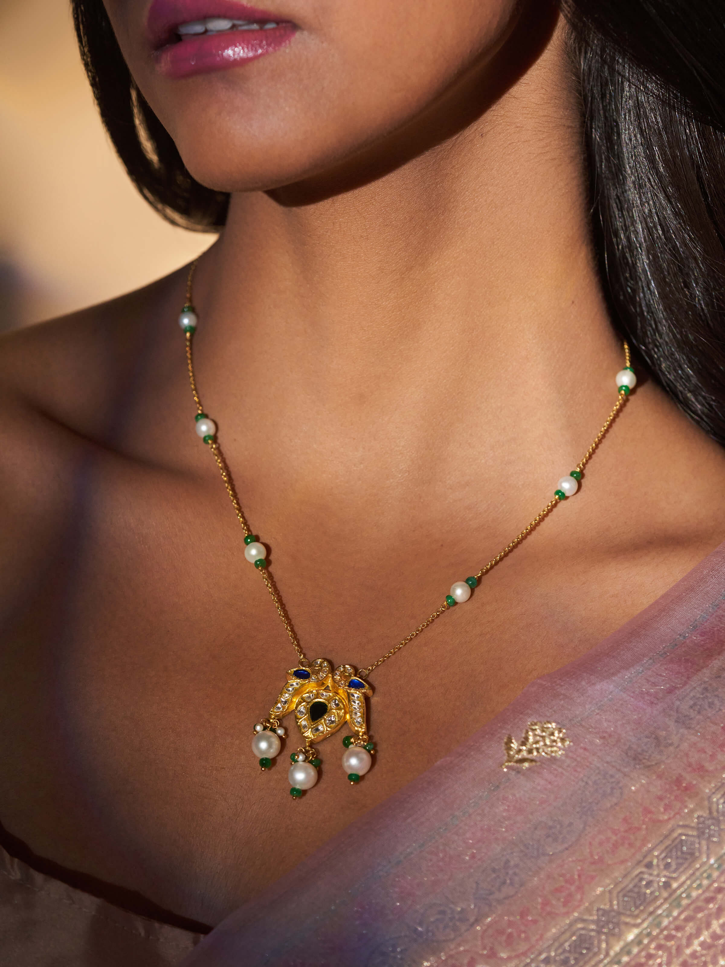 Side view of Swadesh Thappa 22 Karat Gold Pendant & Chain highlighting delicate chain and traditional pendant detailing