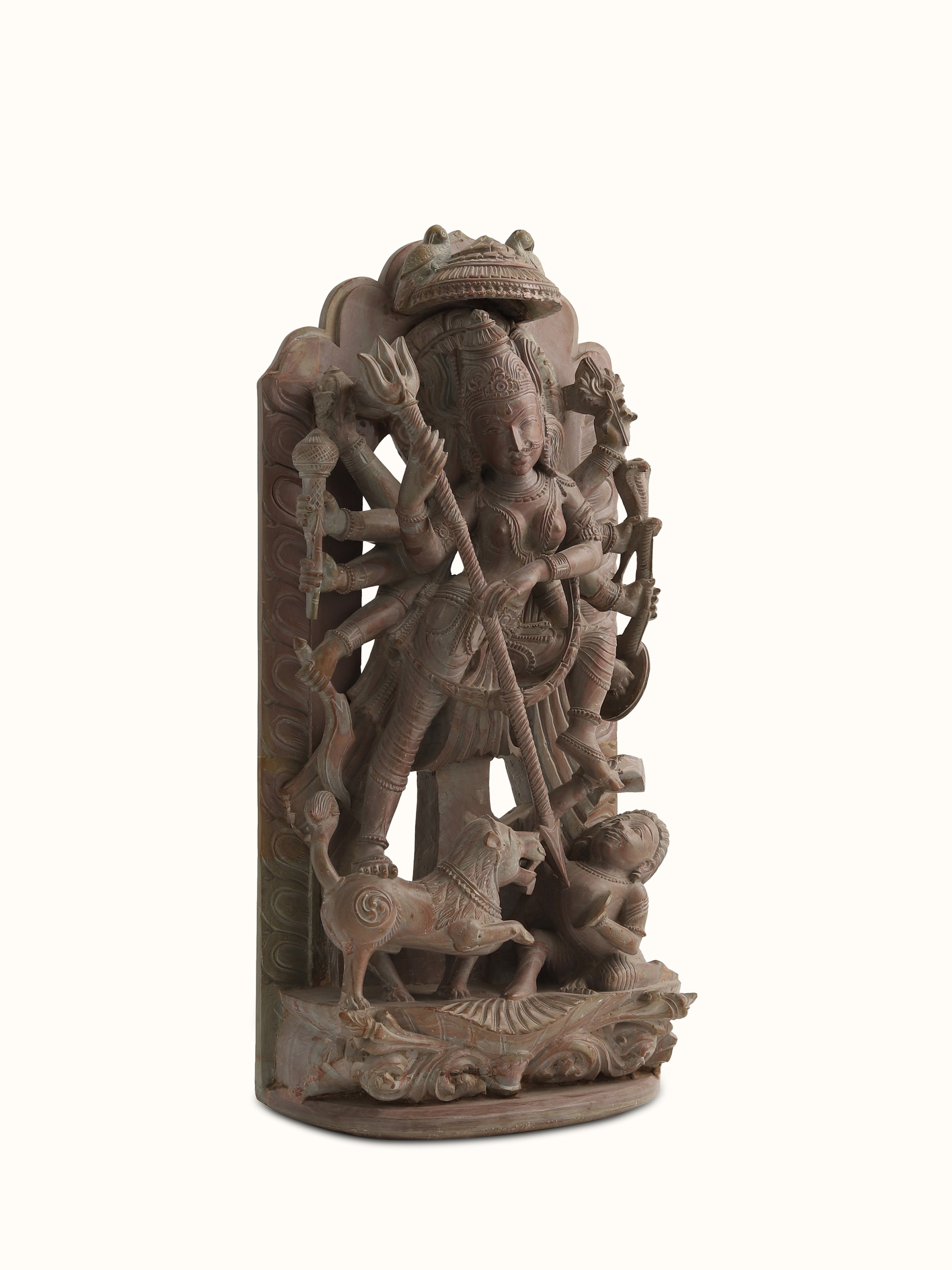 Angled view of Stone Devi Idol, emphasizing the strong contours and refined craftsmanship.