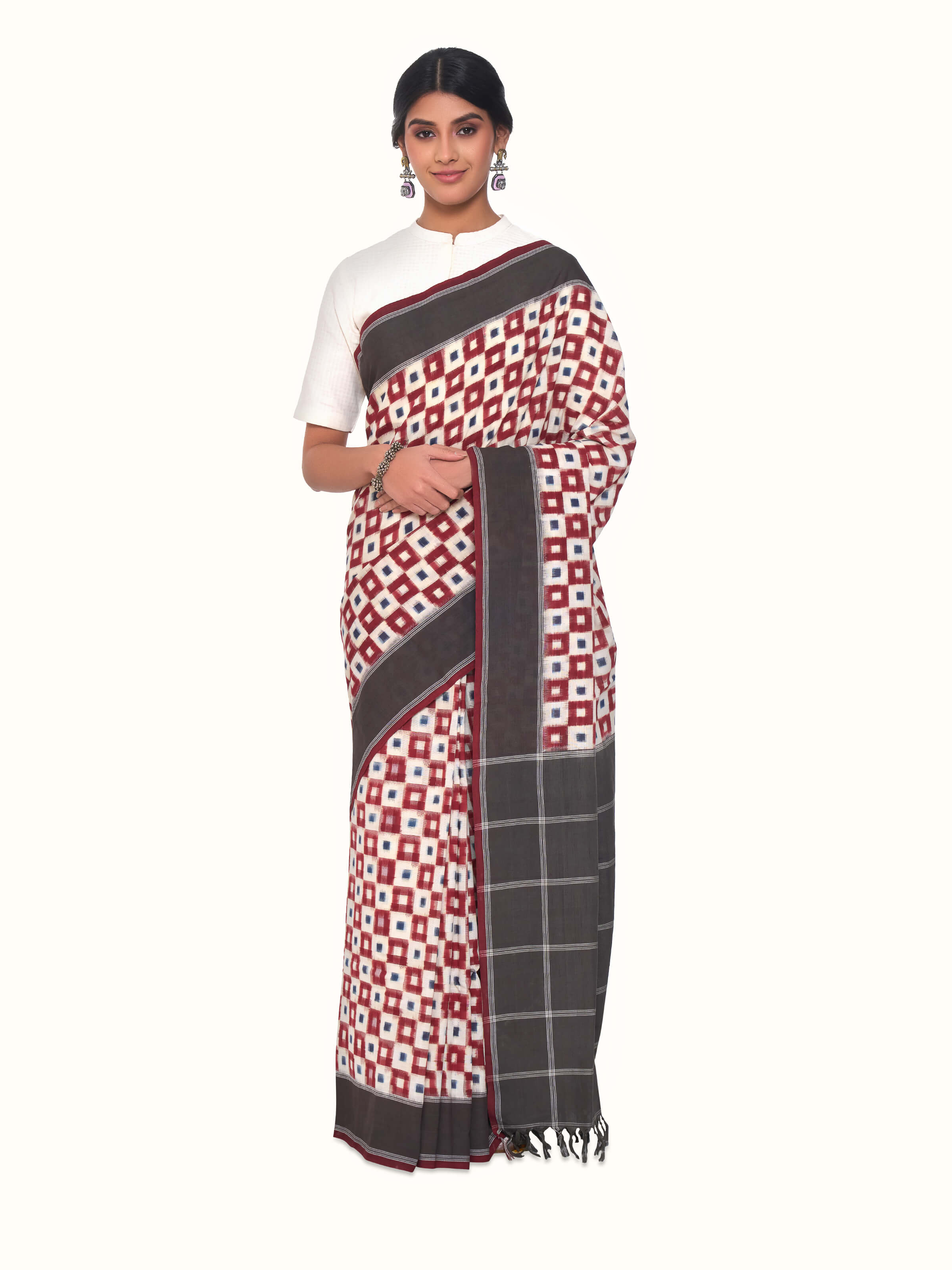 Front view of brown cotton double ikat saree with traditional woven patterns