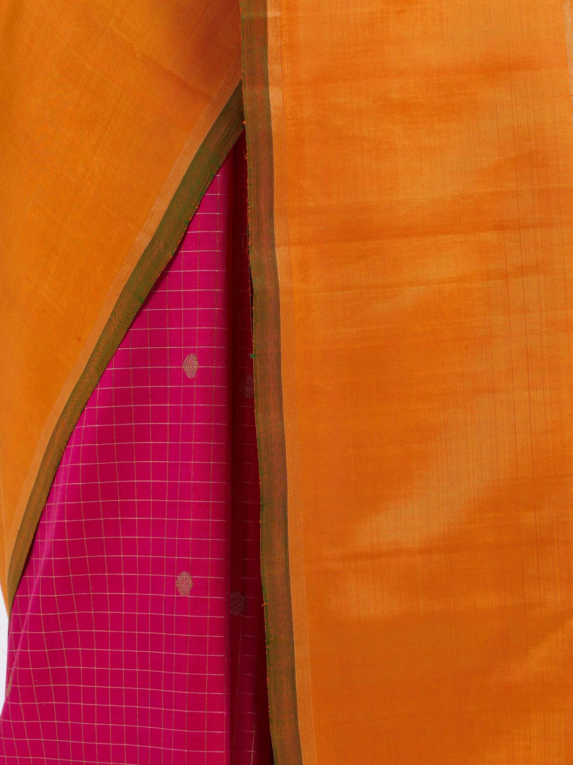 Detail view of pink silk Kancheepuram saree showing silk texture and zari craftsmanship