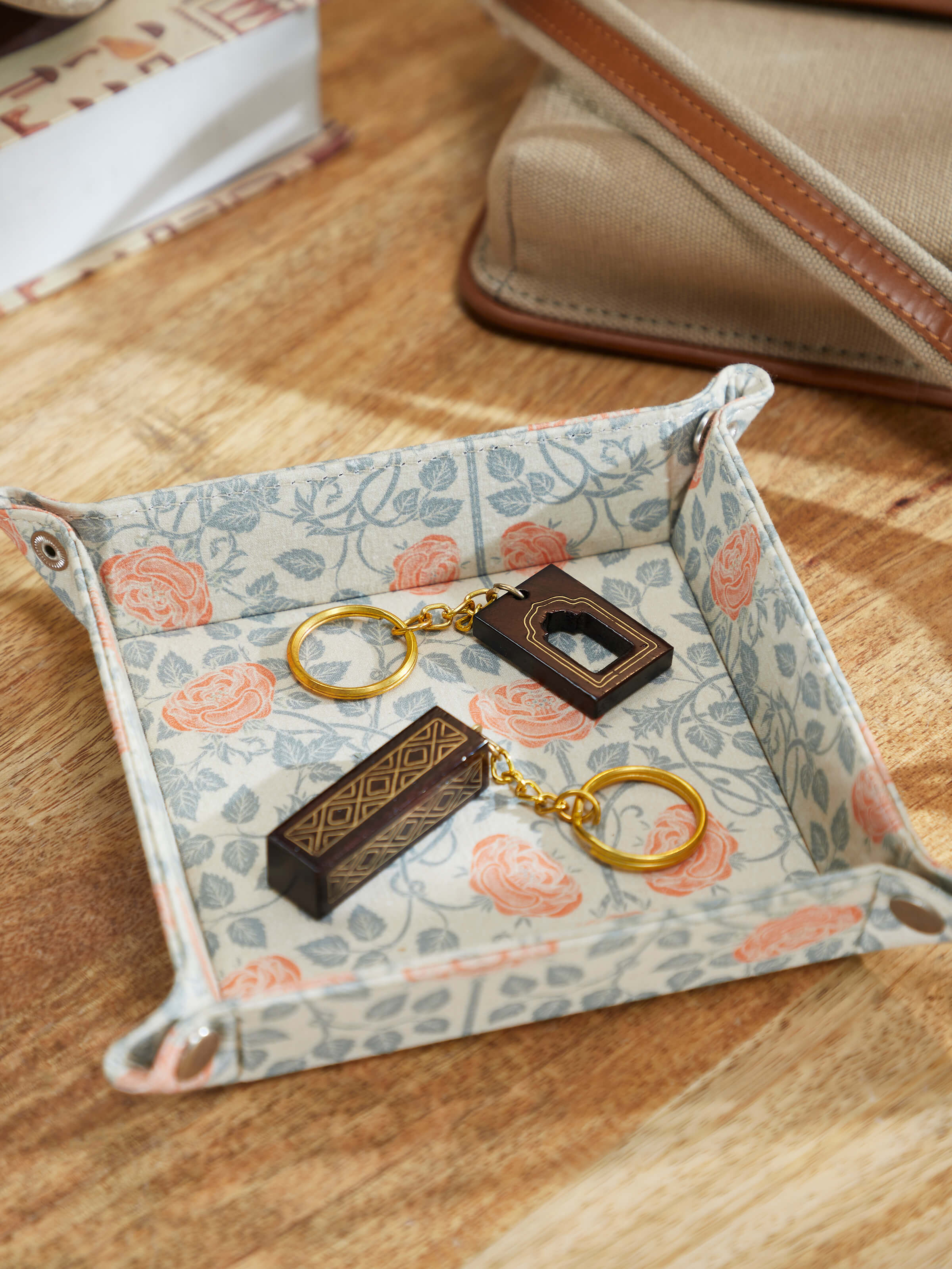 Side view of Tarkashi Sheesham Wood & Brass Arch Keychains by Swadesh highlighting their intricate detailing and fine woodwork.