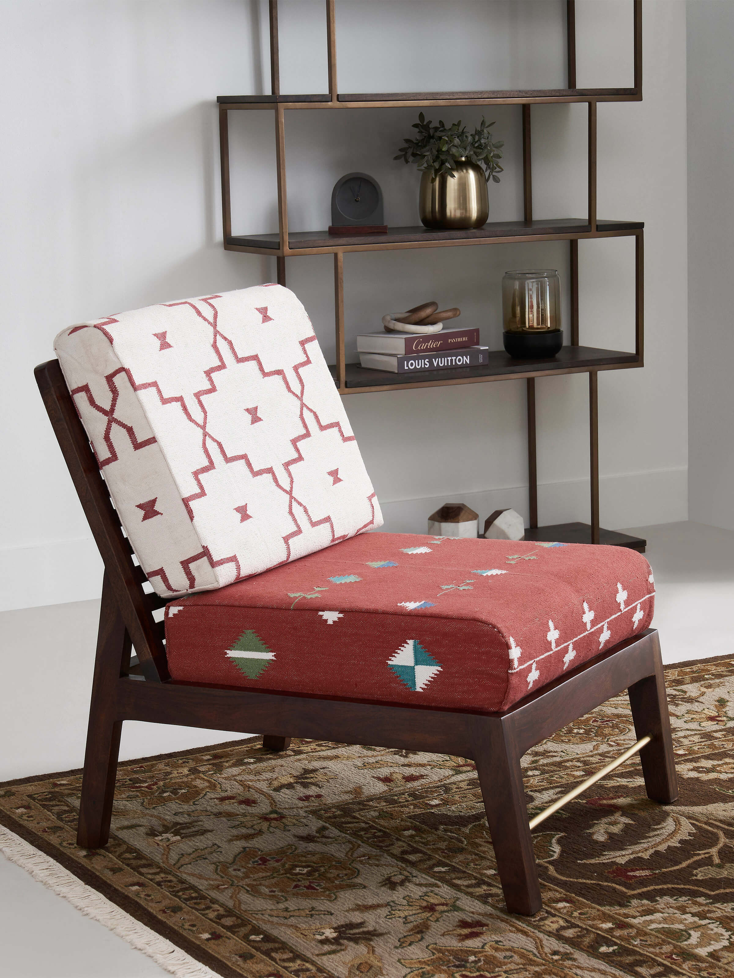 Side view of Panja Dhurrie Upholstered Sheesham Wood Lounge Chair, emphasizing its smooth wooden frame and cozy cushion.