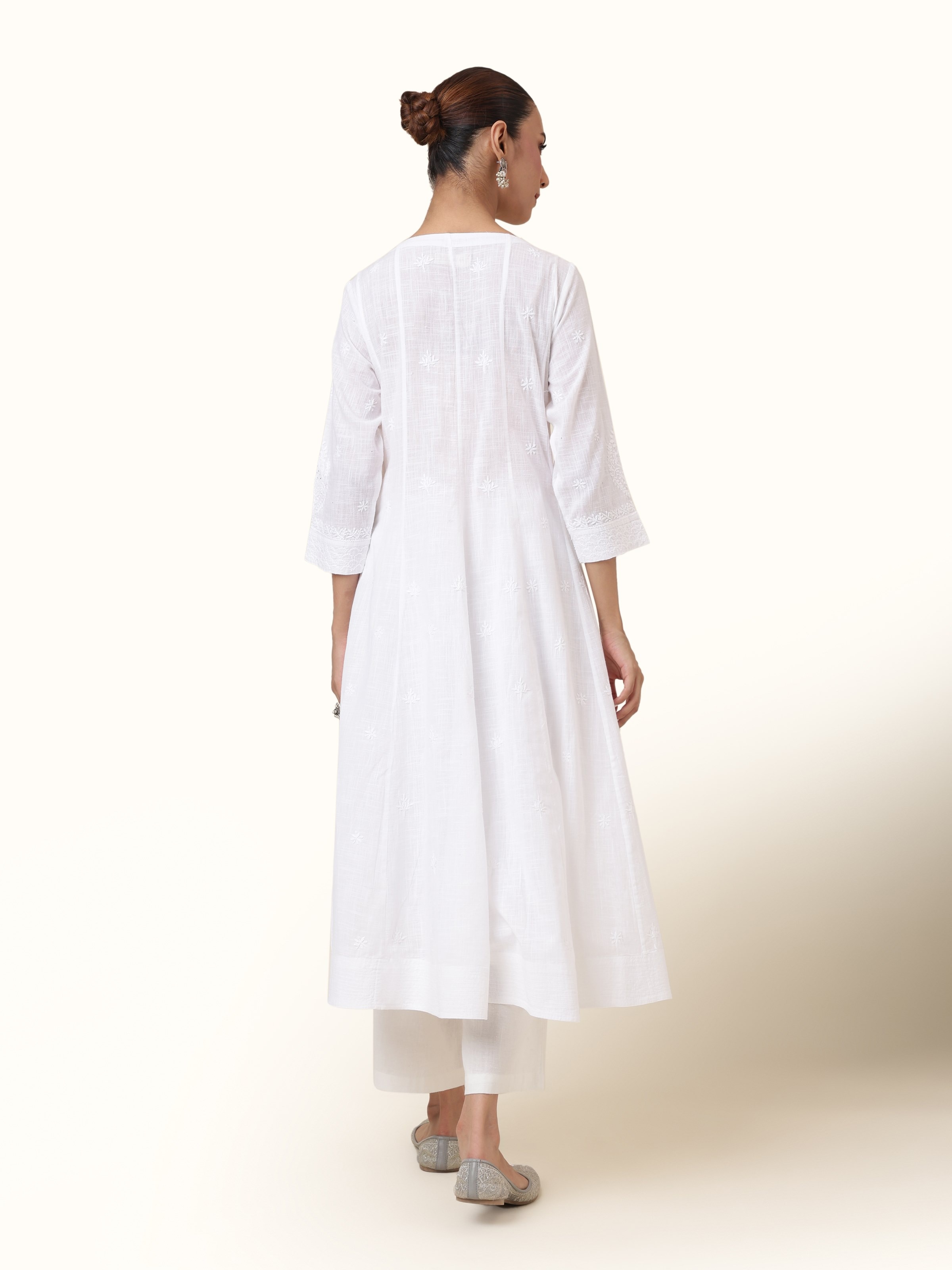 Back view revealing the classic structure and beautiful finishing of the kurta.