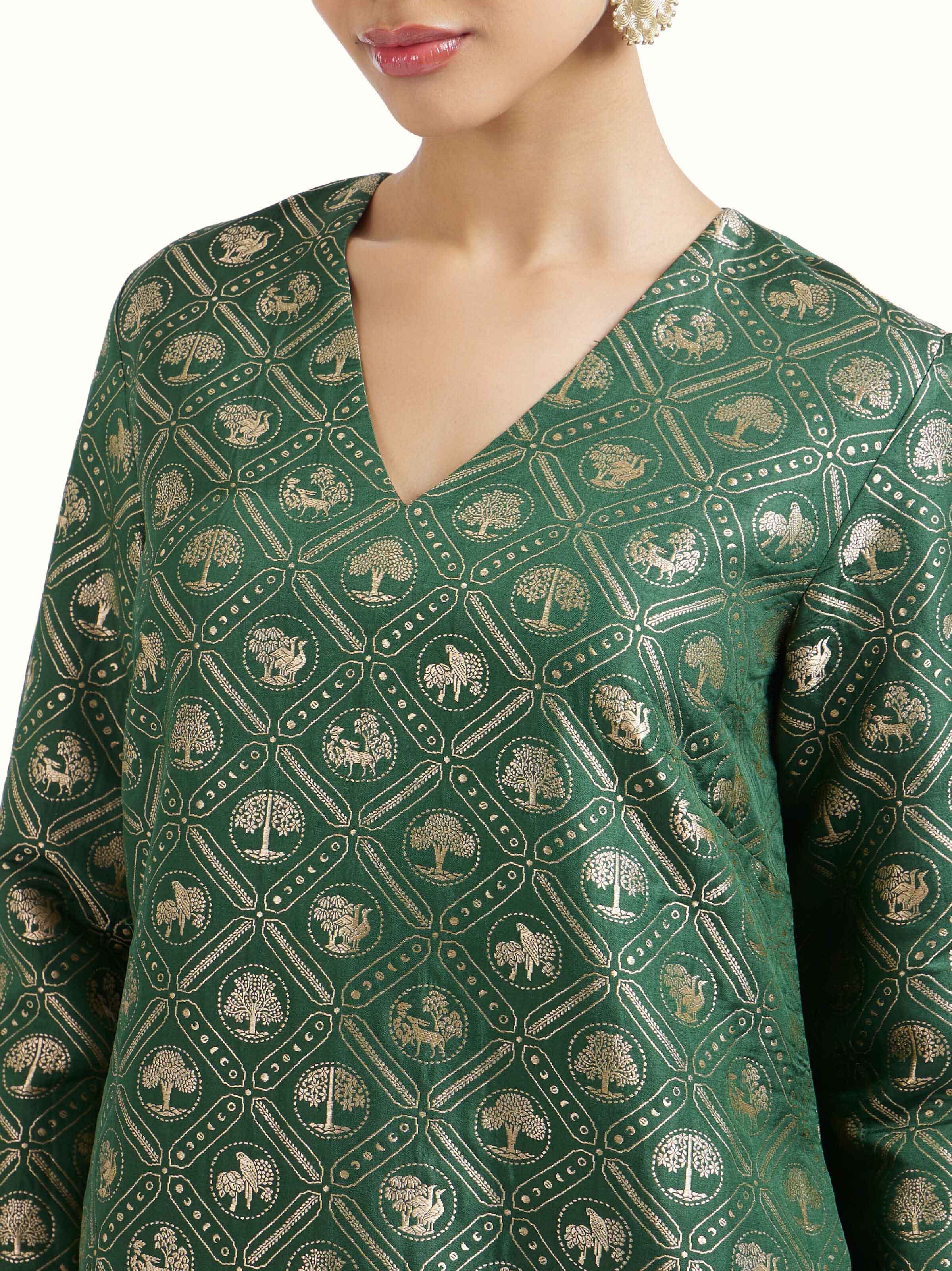 Detail view of emerald green Banarasi kurta set showing fabric texture
