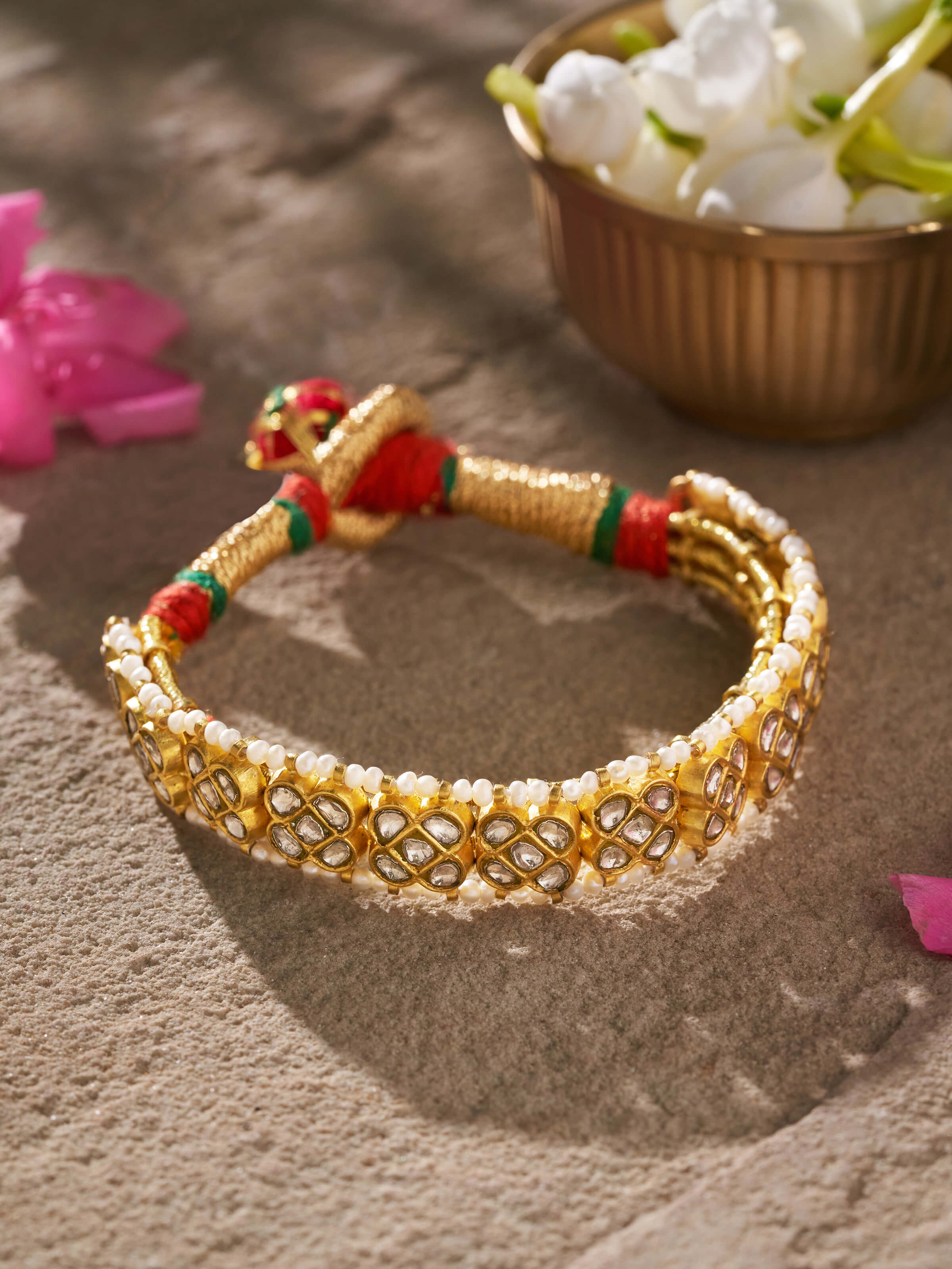 Side angle view capturing the flexible design and intricate gold patterns