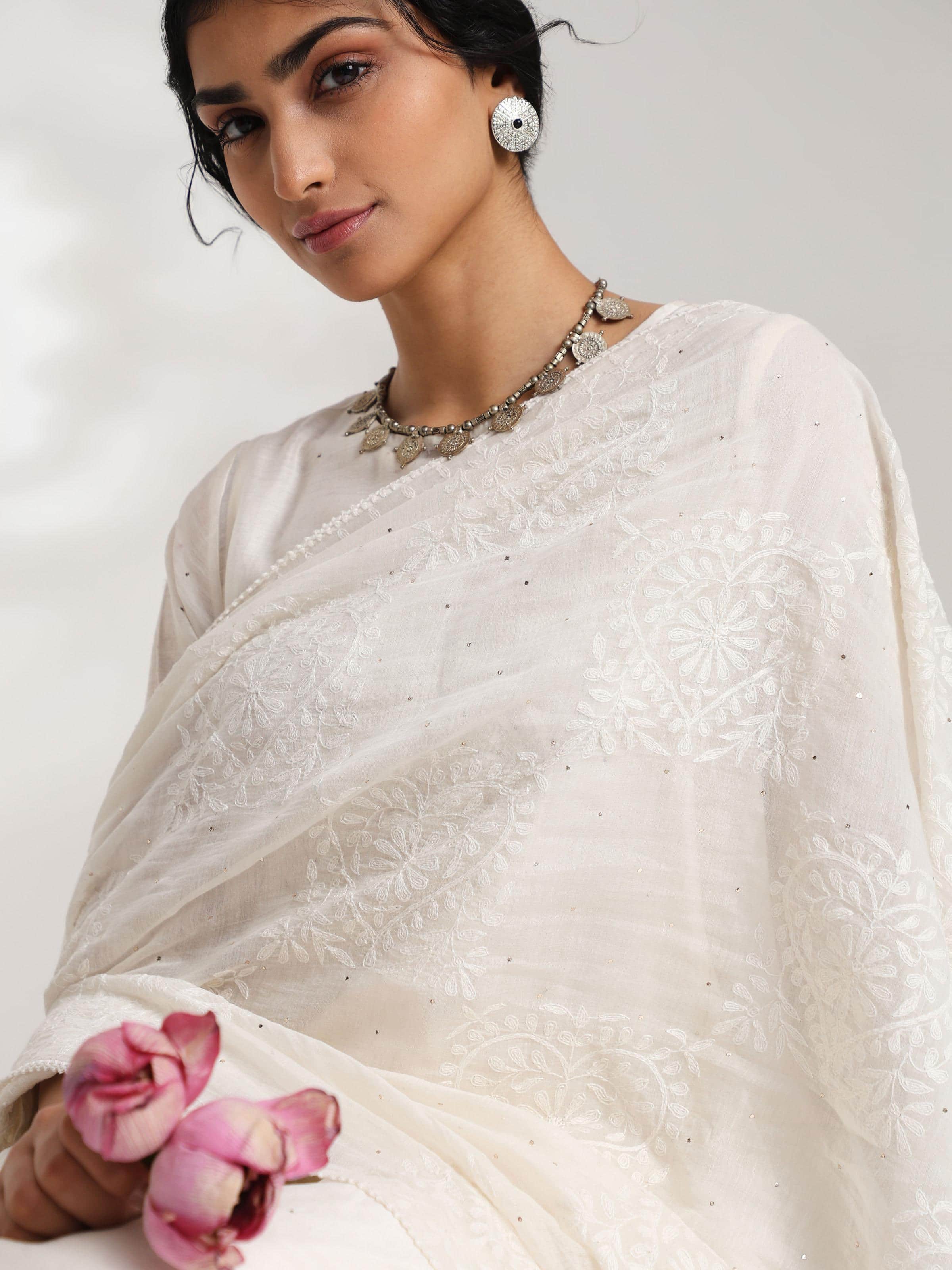 Side view of elegant chikankari patterns on off-white dupatta