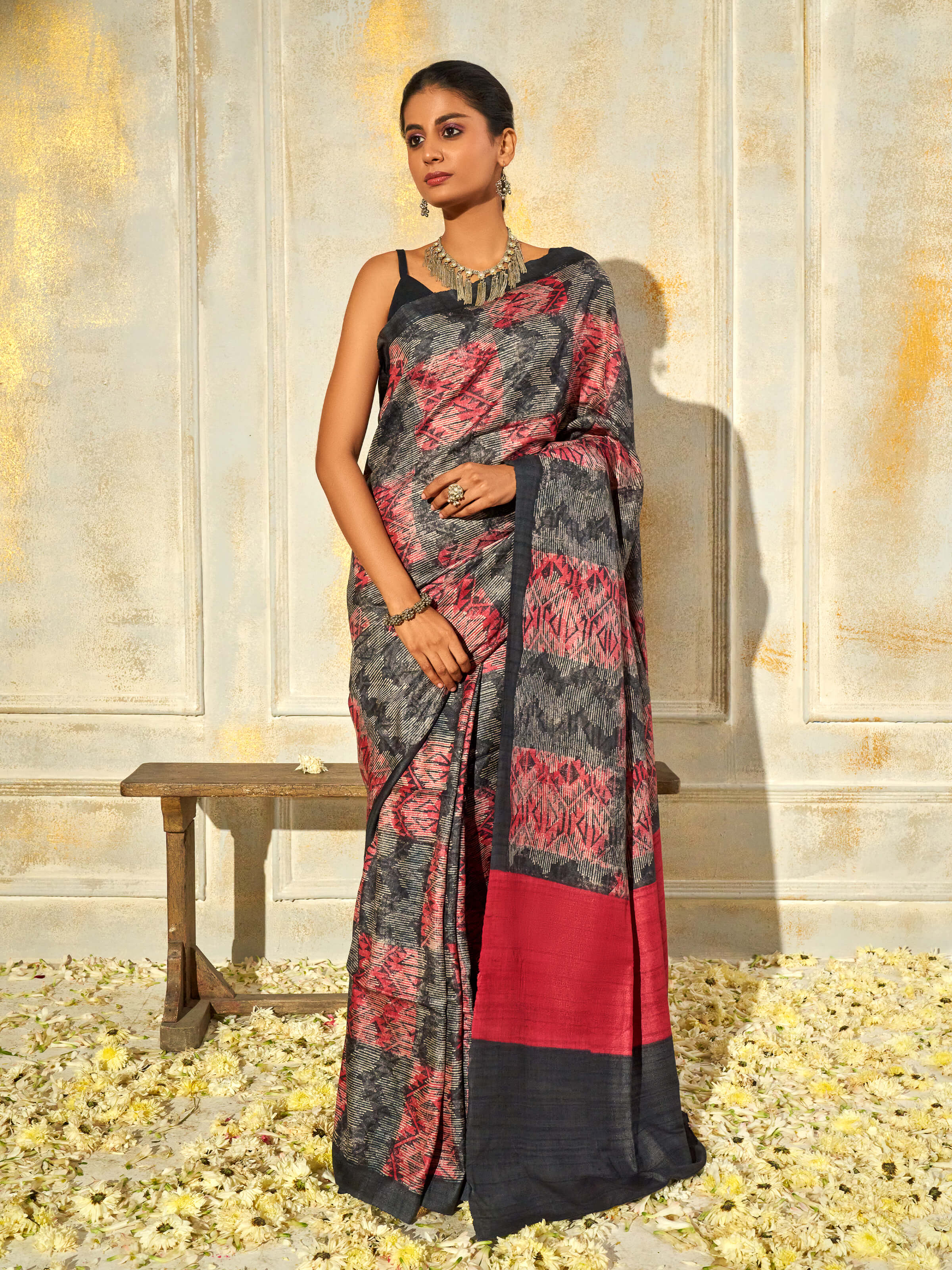Side view of black tussar silk discharge block printed saree showcasing natural texture