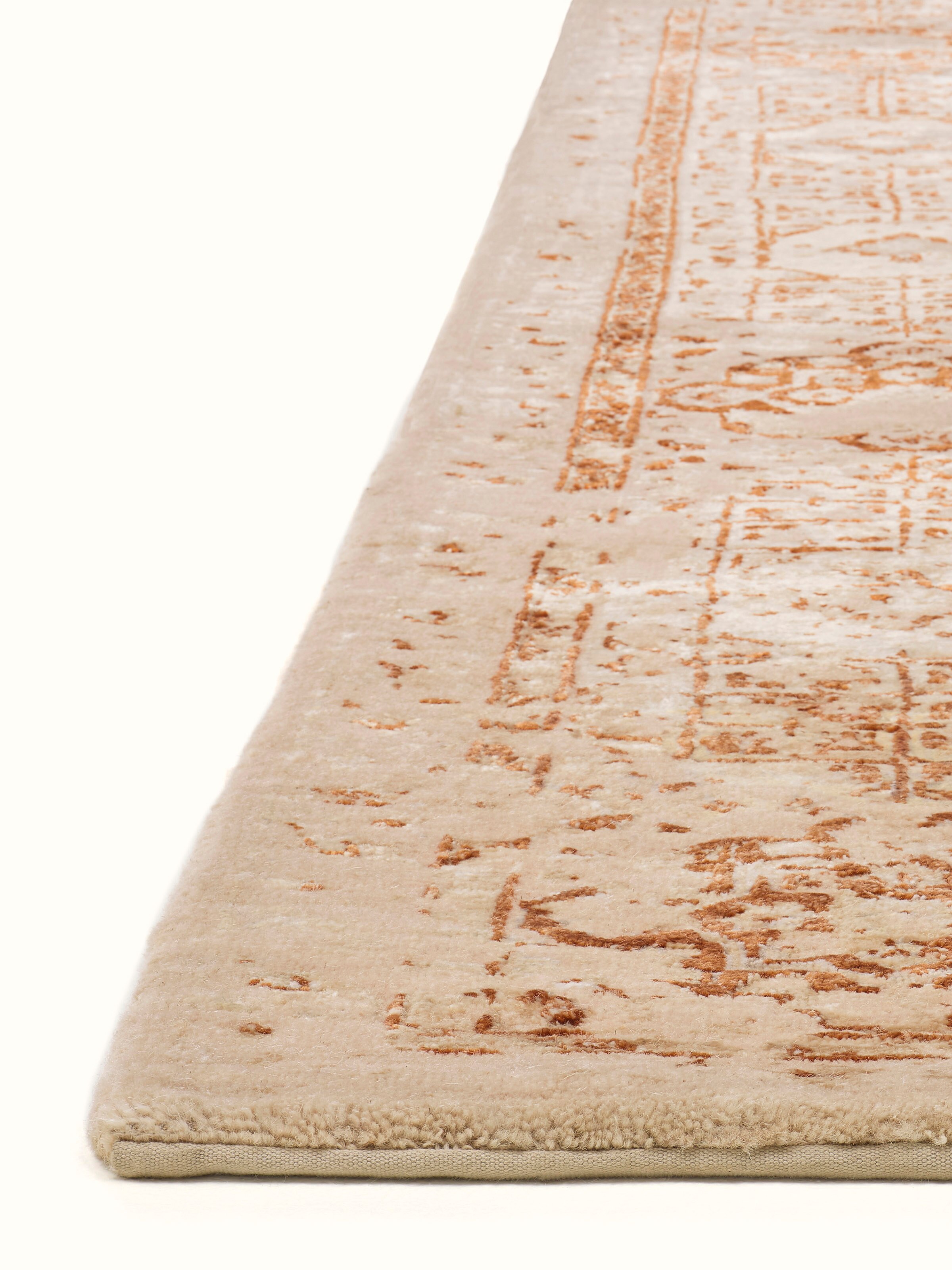 Angled view of Distressed Mamluk Beige Rust Bhadohi Wool & Viscose Hand-Knotted Rug emphasizing the depth of its design