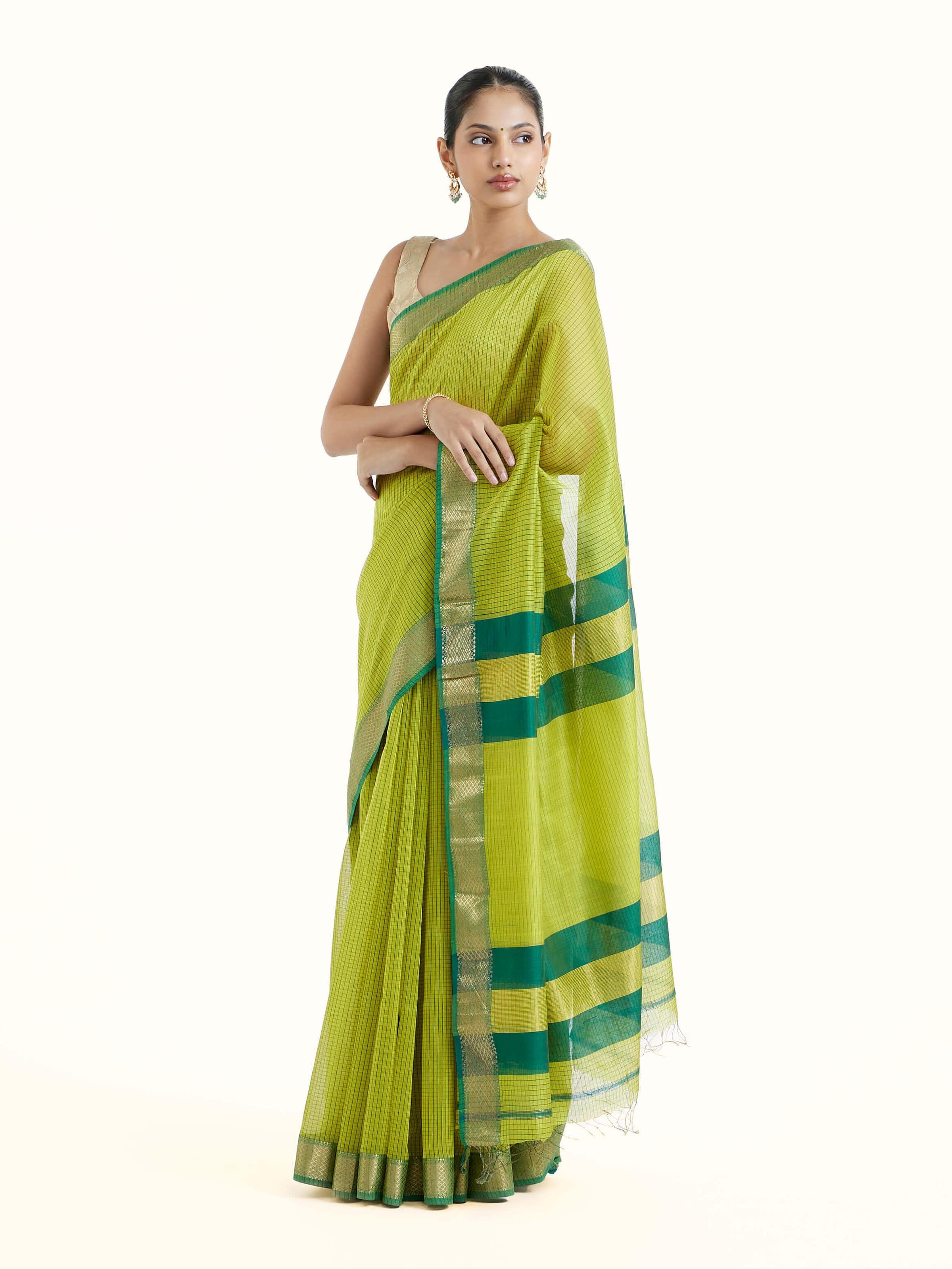 Side view of green cotton silk Maheshwari saree highlighting lightweight drape and border detailing
