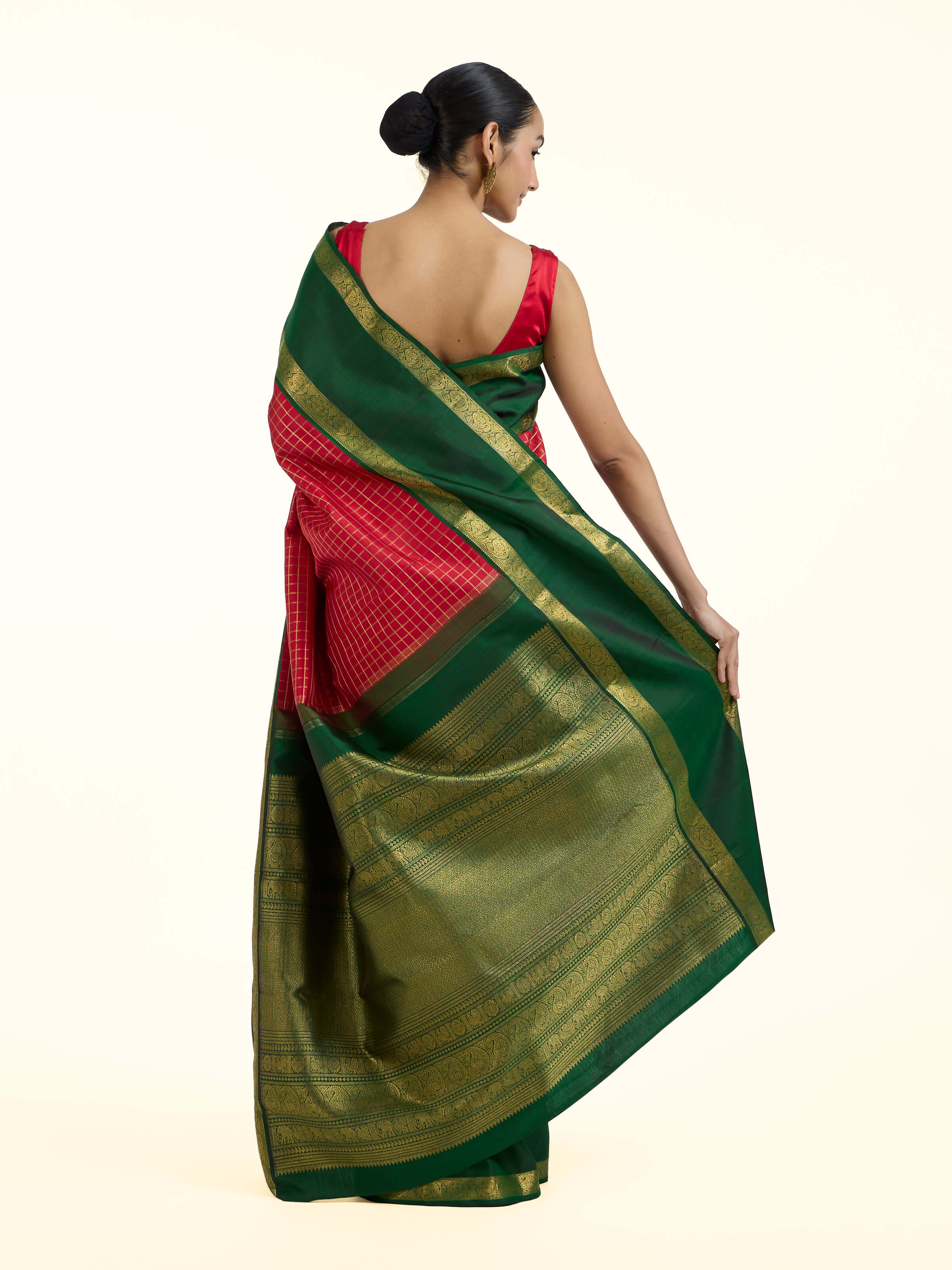 Back view of green silk Kancheepuram saree displaying ornate pallu