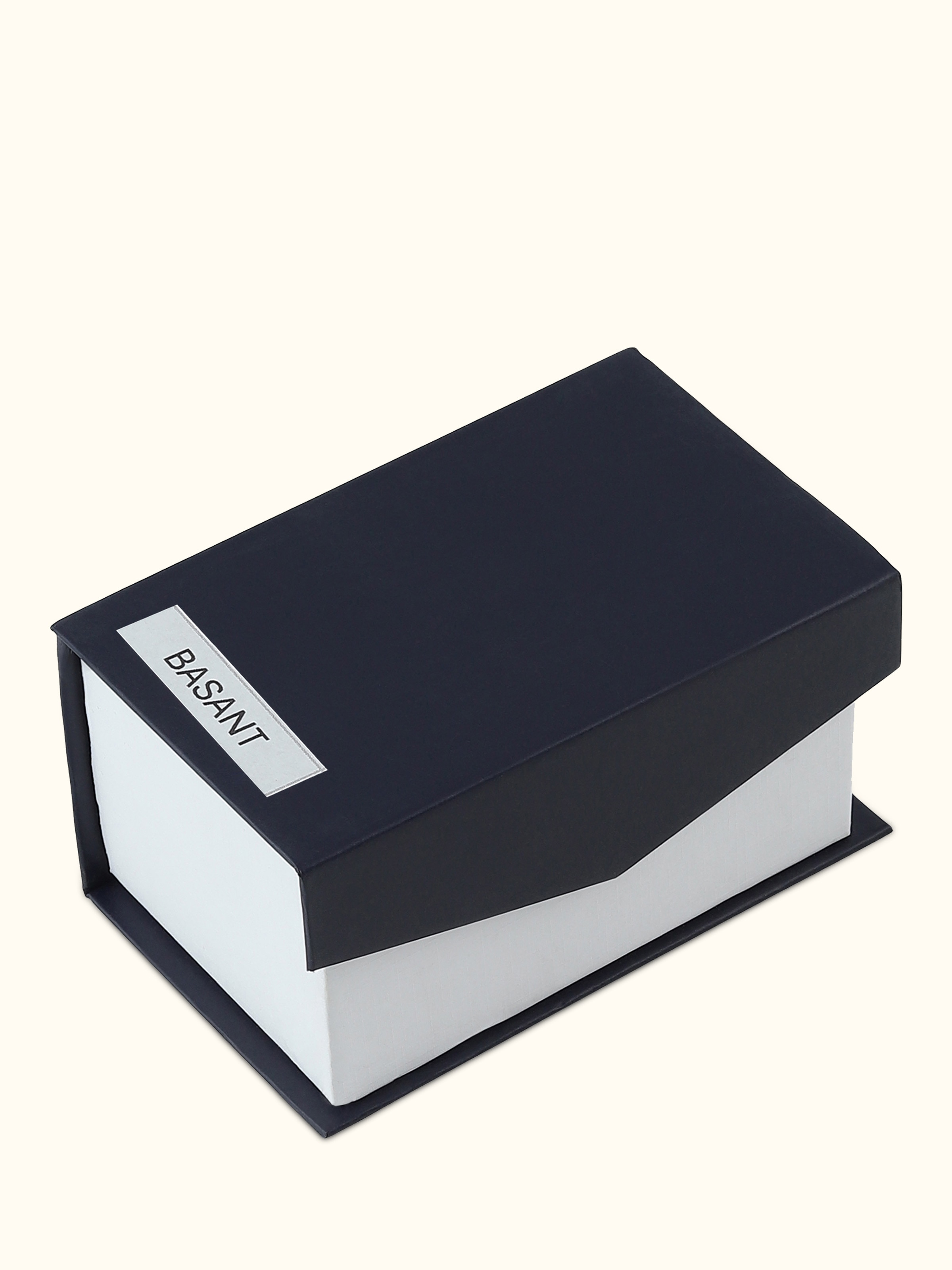 Rear view of Attar Basant perfume focusing on the contours and smooth reflective finish