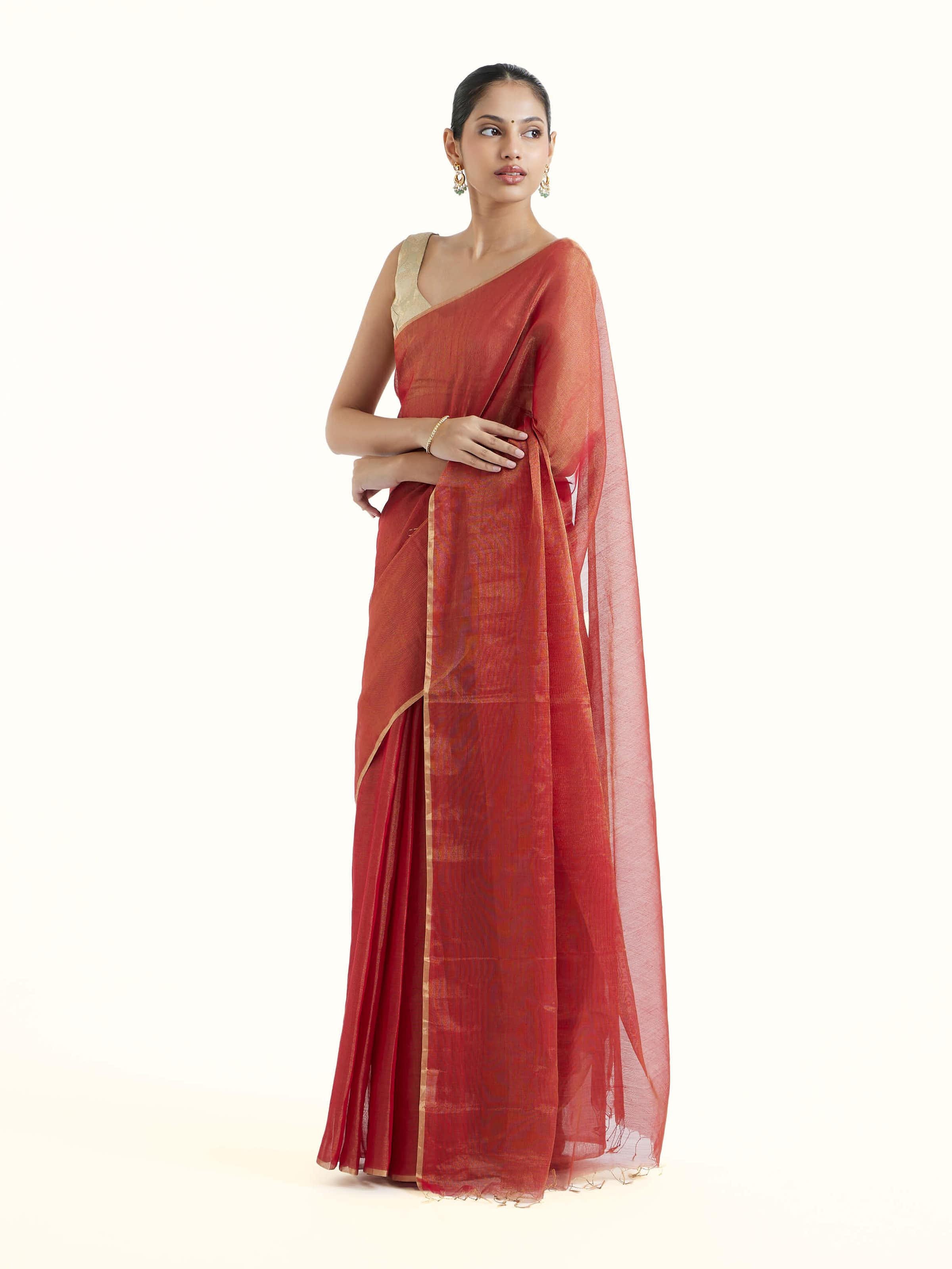 Side view of red cotton silk Maheshwari saree showcasing silk-cotton texture
