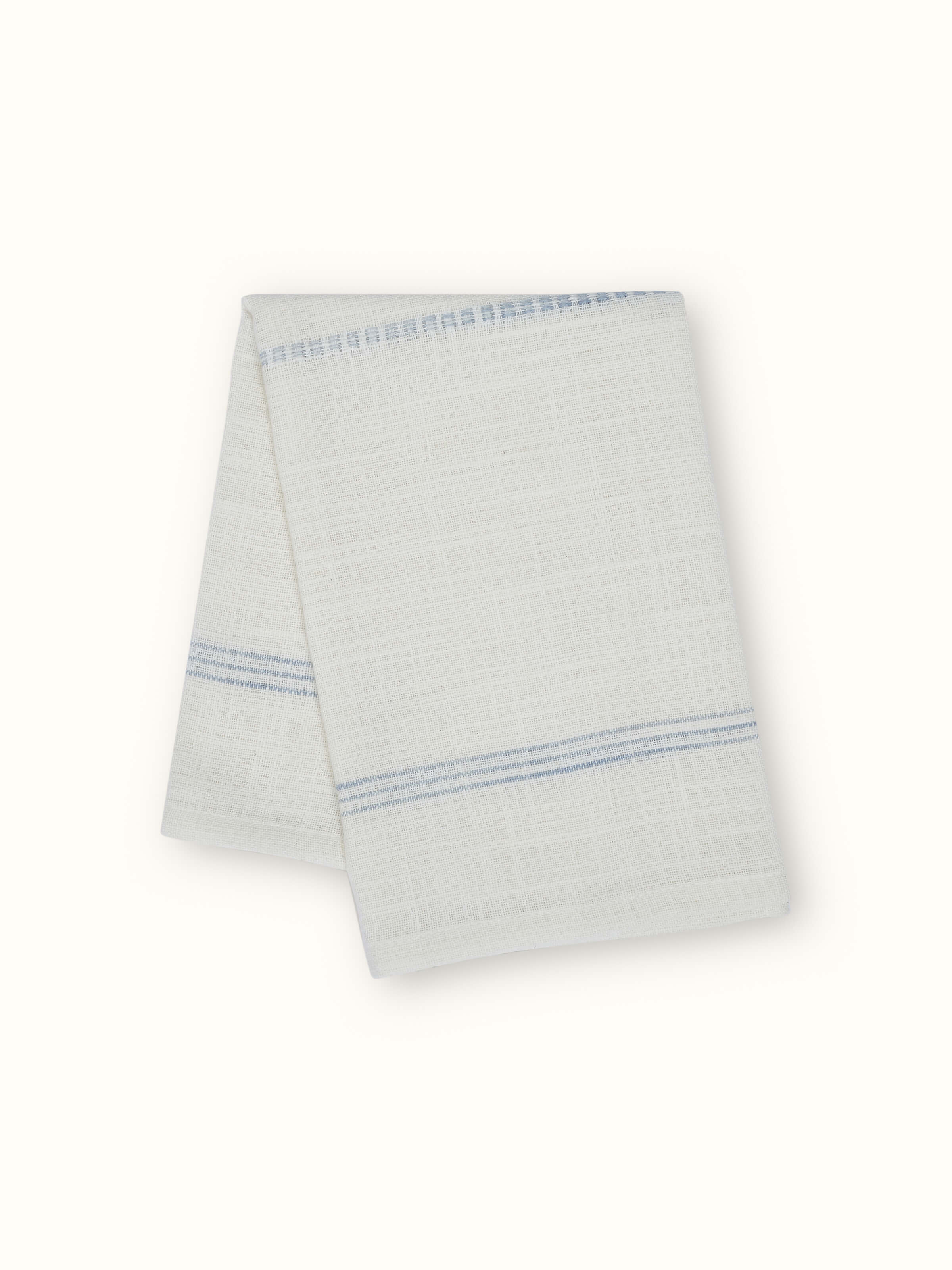 Close-up of Arth light blue stripe cotton handloom napkins highlighting the fine striped weave and hemmed edges.