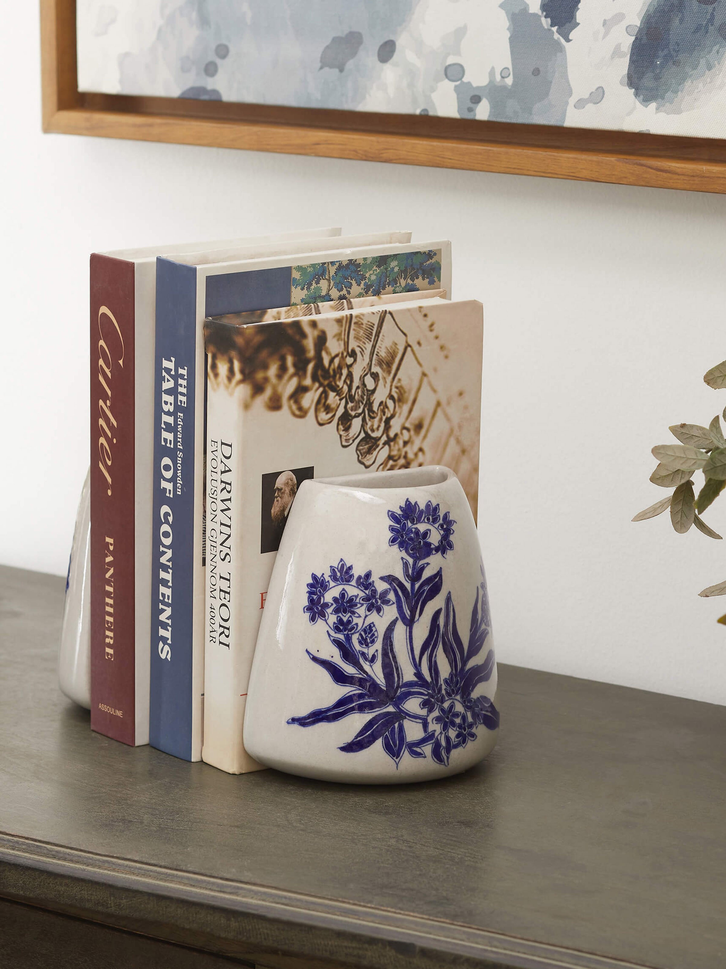 Side view of Blue Pottery Ceramic Floral Table Vases (2 Pcs) from Swadesh, showcasing intricate floral designs and a bright ceramic finish.