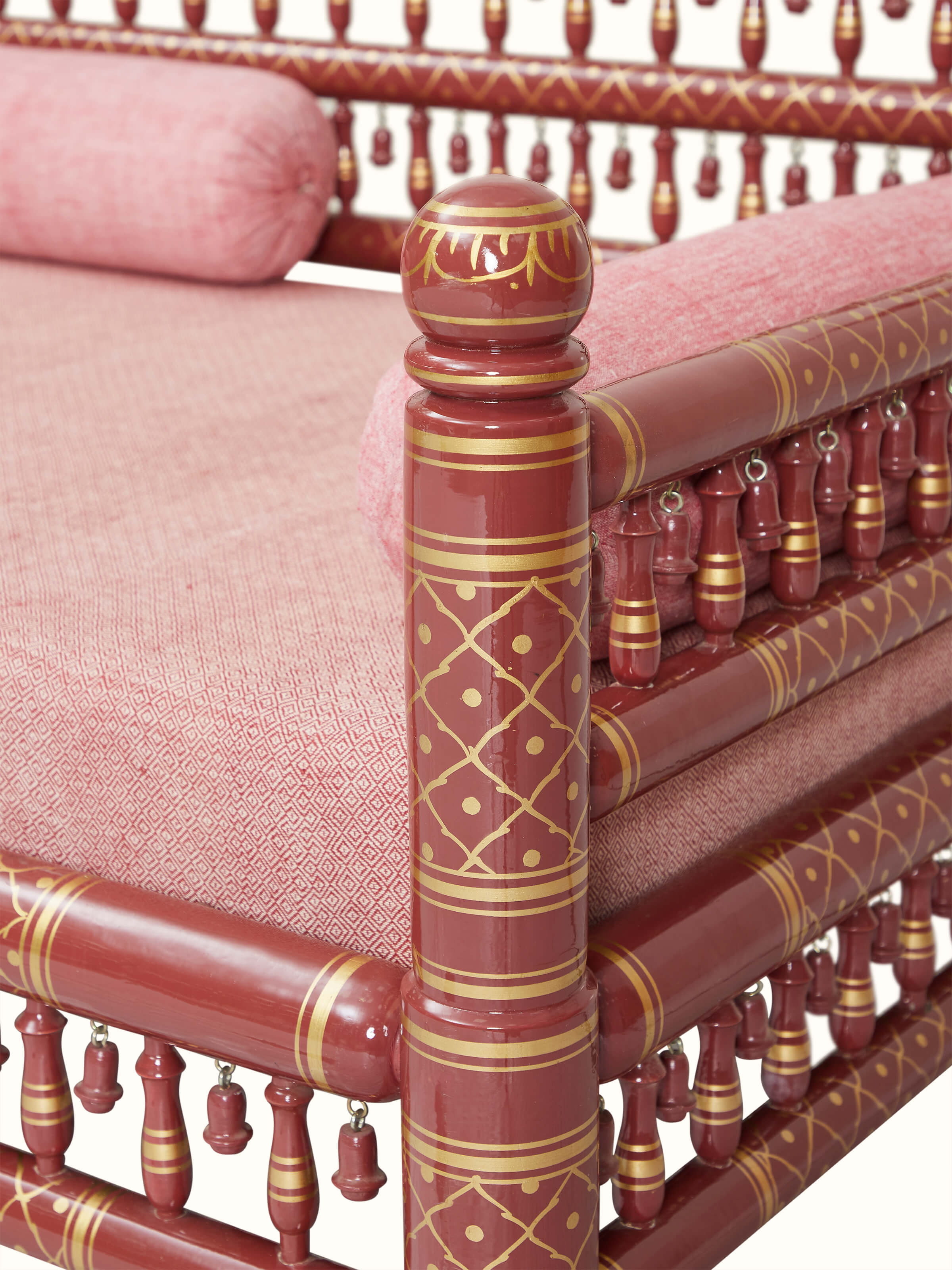 Side view of Upholstered Teak Wood Sankheda 3-Seater Sofa highlighting the luxurious upholstery and elegant wood details