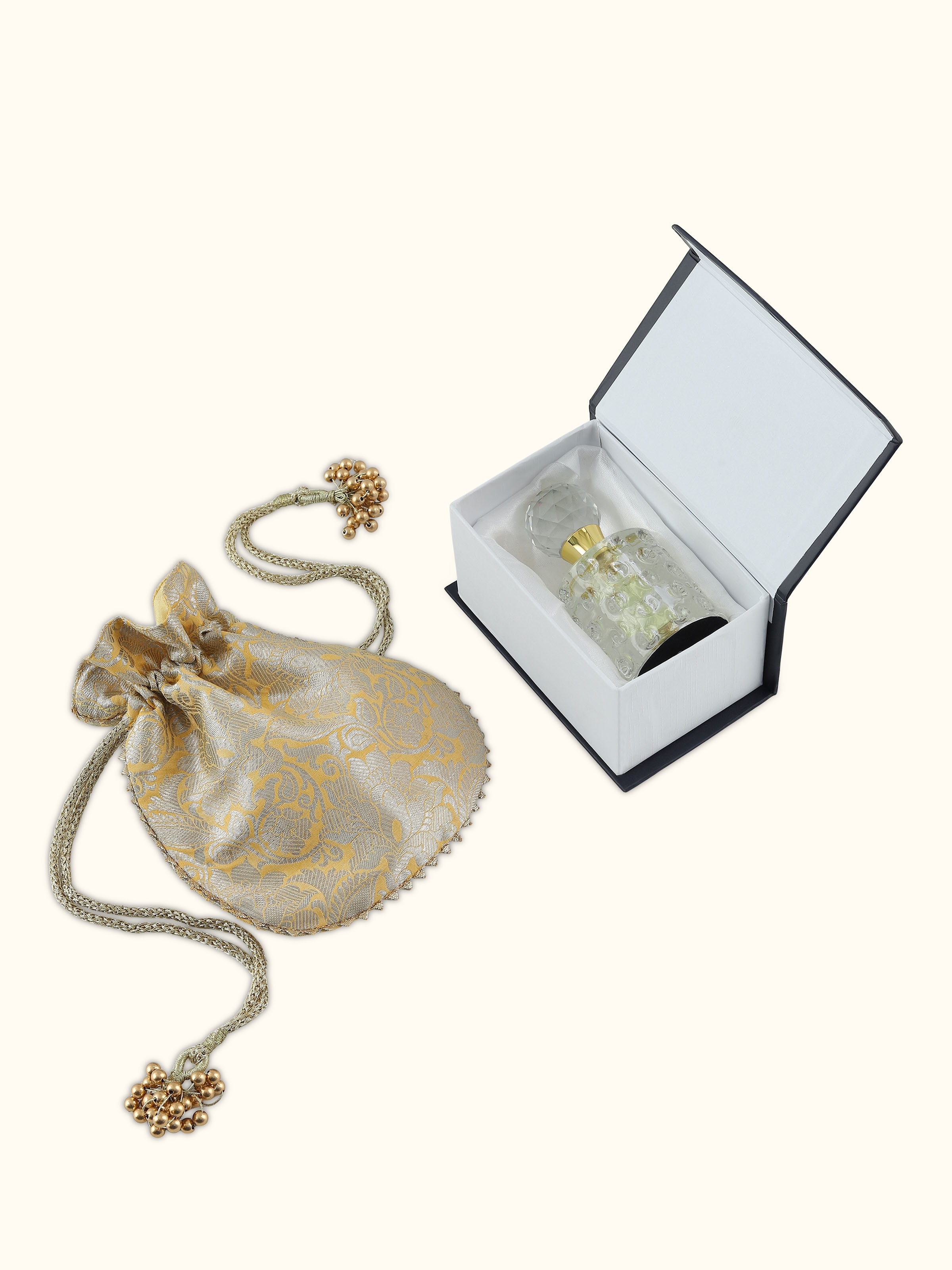 Top view of Attar Basant attar bottle showcasing the elegant cap and compact structure