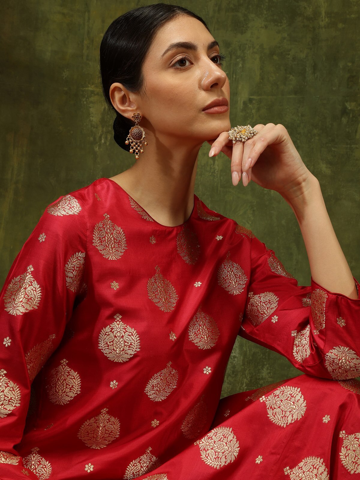 Angled lifestyle view displaying maroon Banarasi kurta with fine silk weave