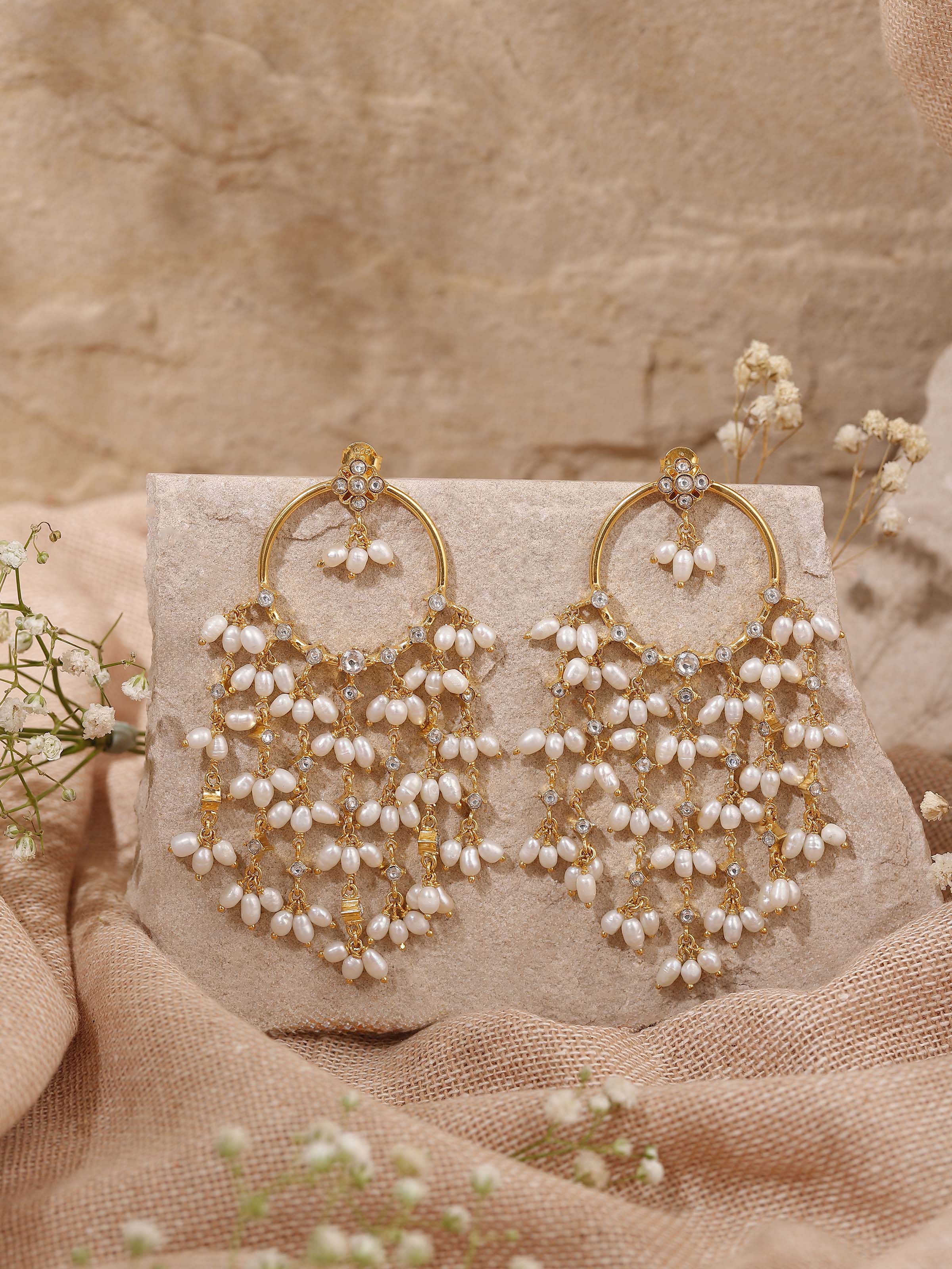 Lifestyle view showing the earrings styled with festive makeup and hairstyle for a cultural celebration.