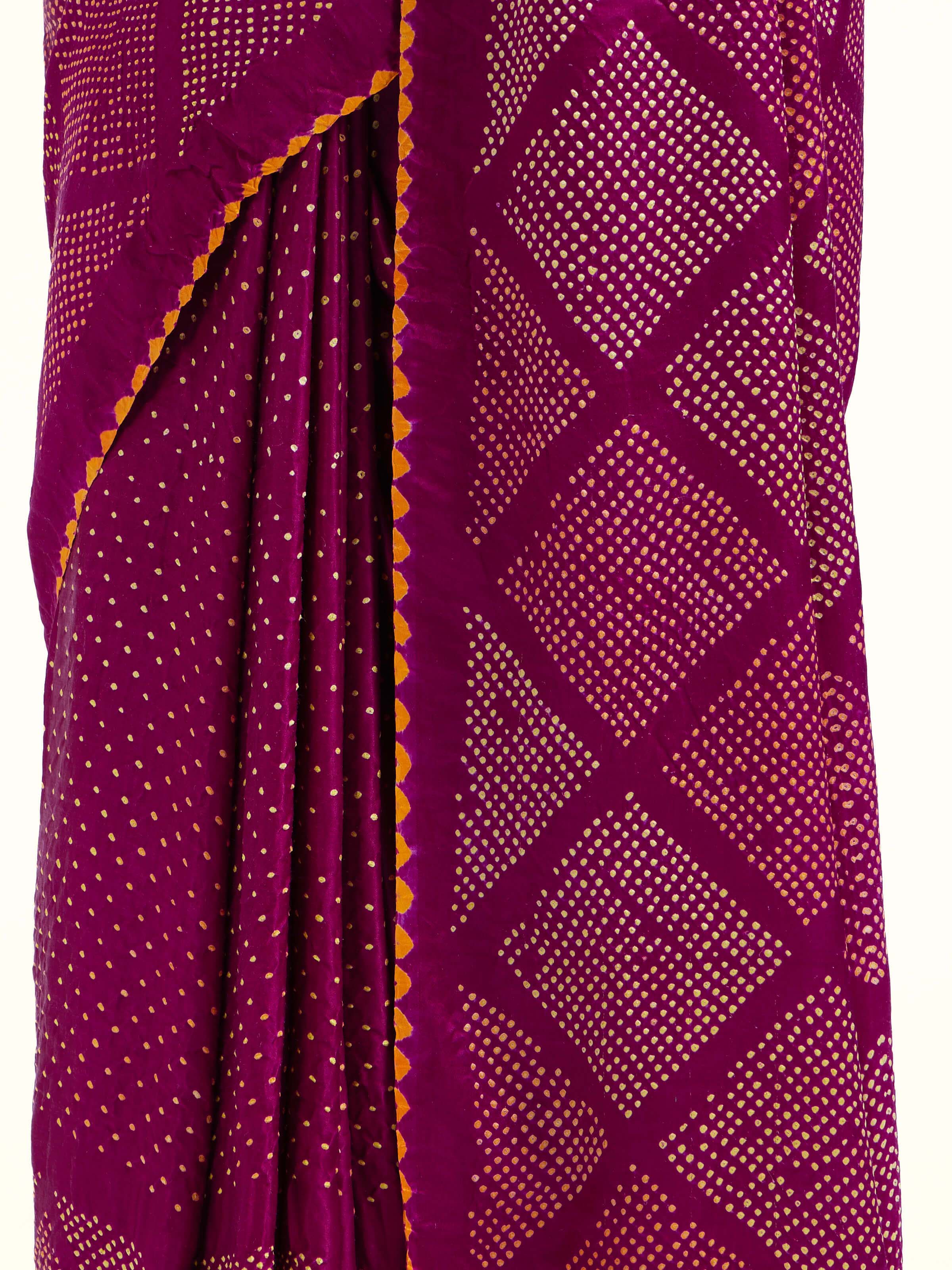 Detail view of purple silk tie and dye Bandhani saree showing dye technique